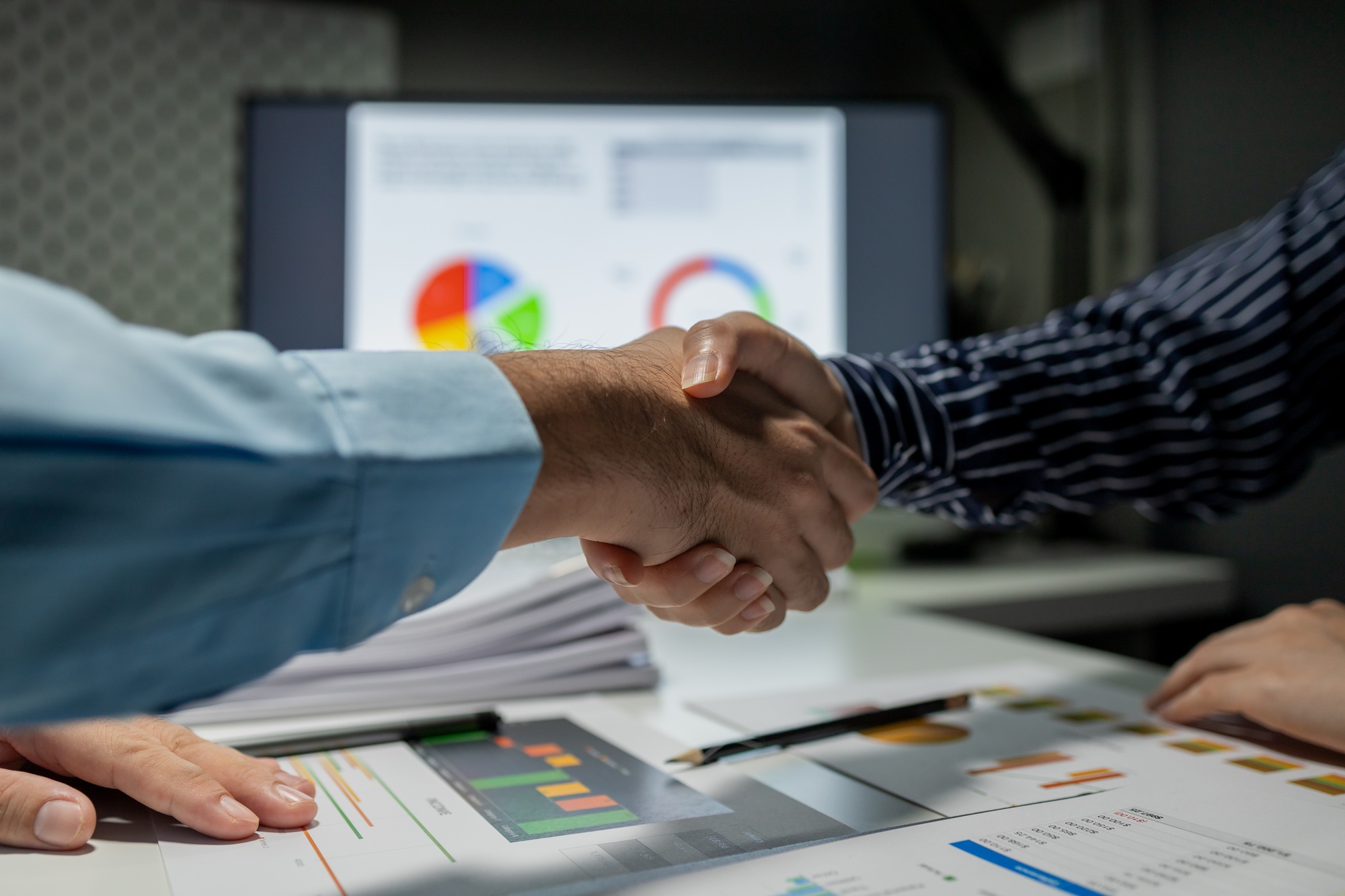 partnership and business people shaking hands in the office for a deal, collaboration or onboarding,