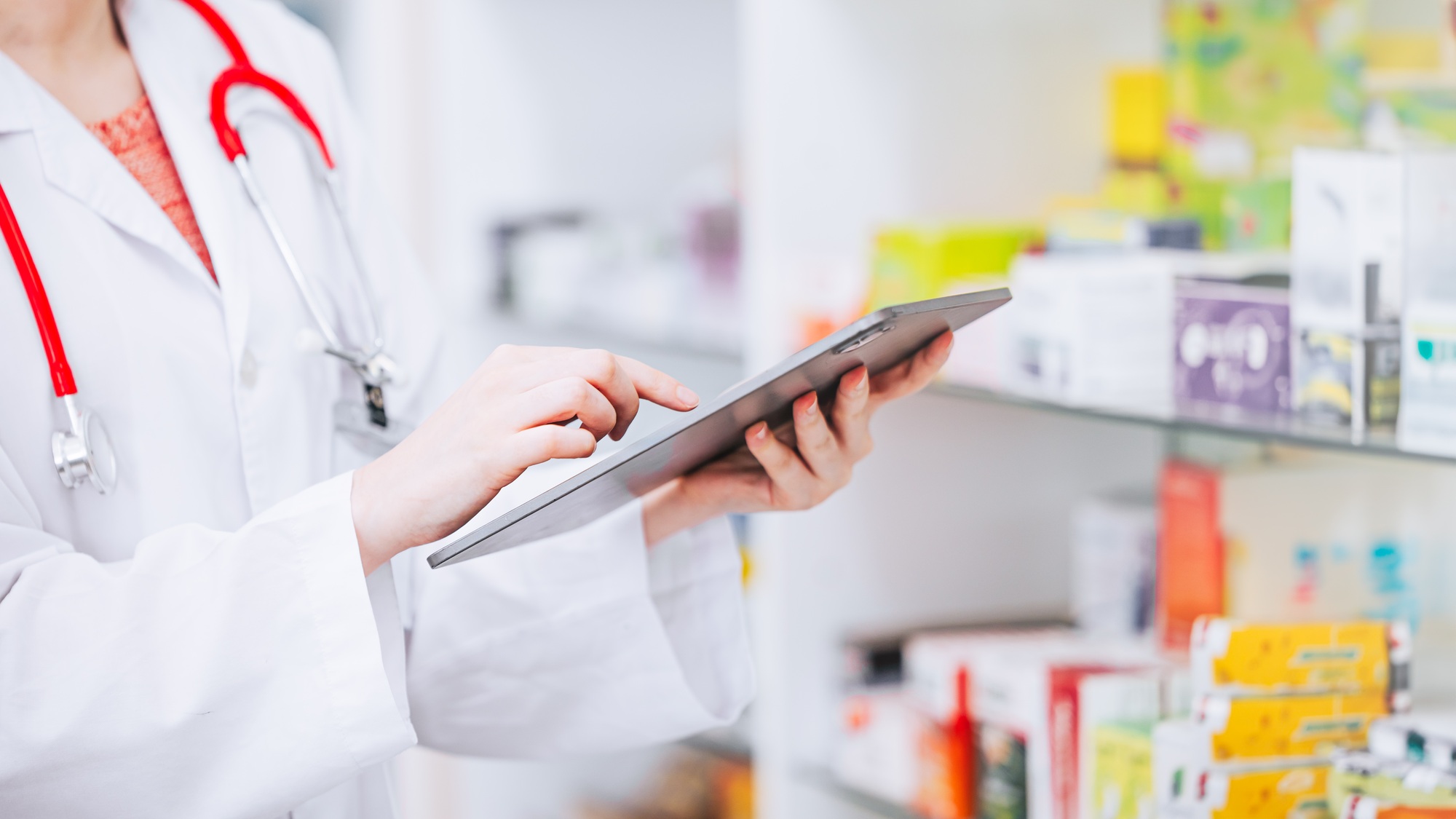Pharmacist checking drugs stock inventory in Pharmacy business. Drugstore expire date stock