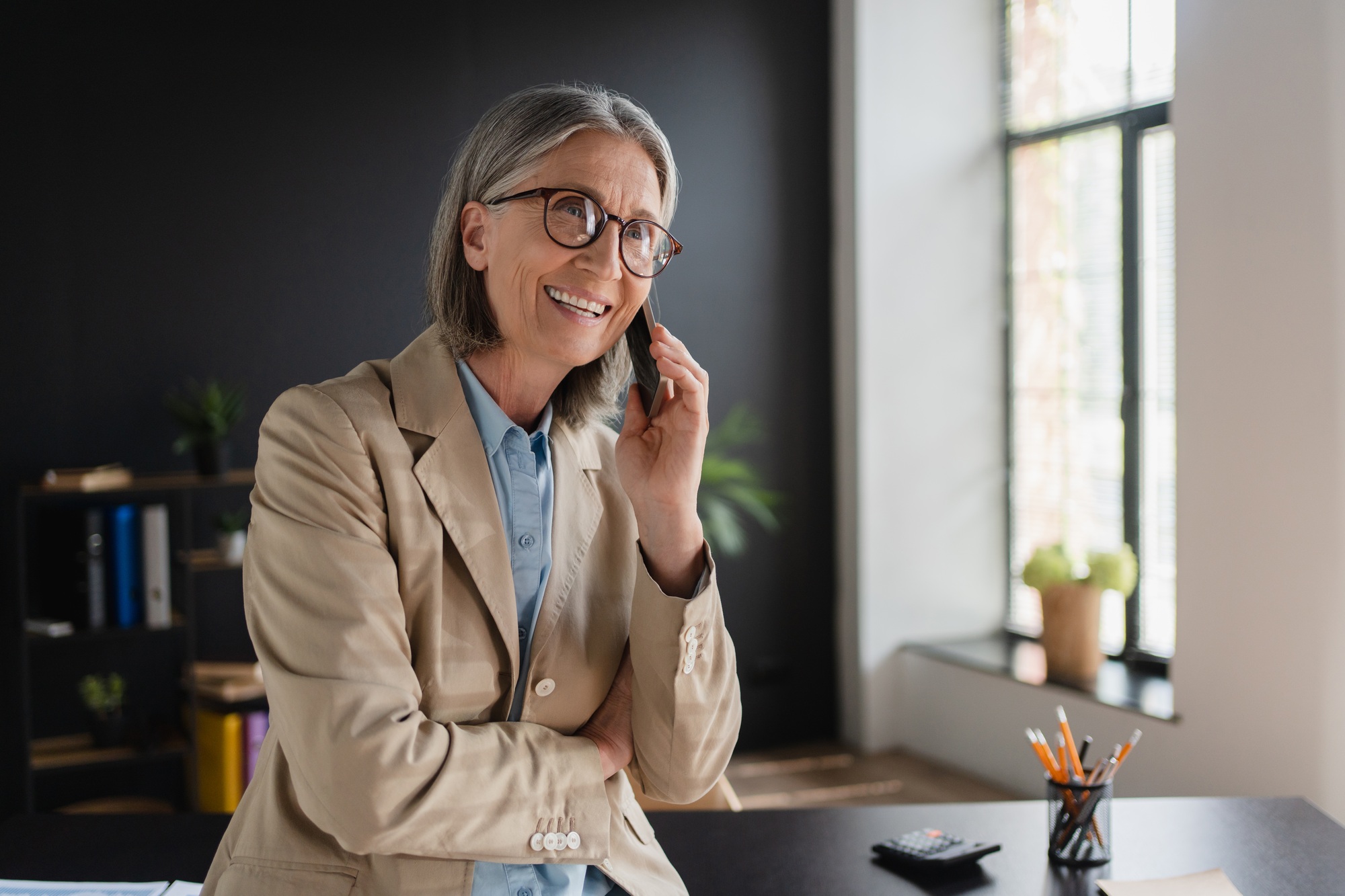 Phone call, business woman sitting in office building for sales communication networking online.