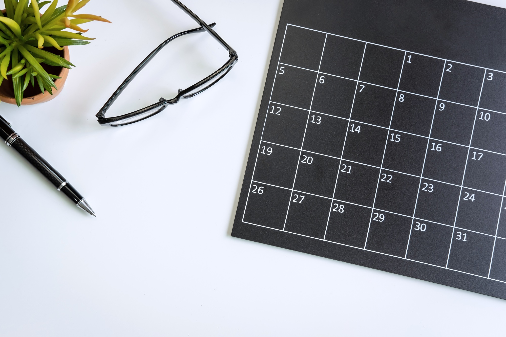 Planning calendar on business desk office, Top view