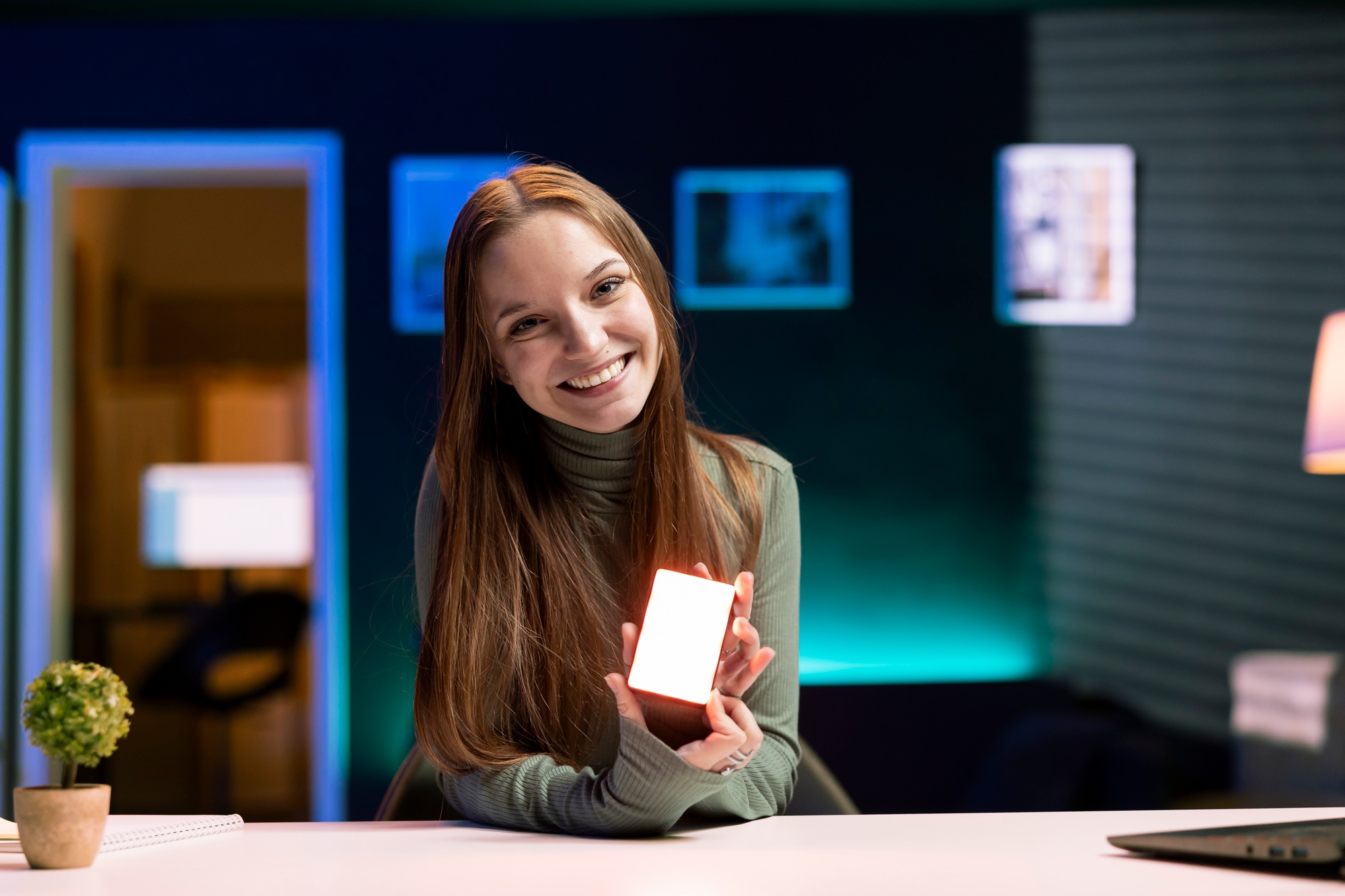 Portrait of joyous teenage girl filming content about video production tools
