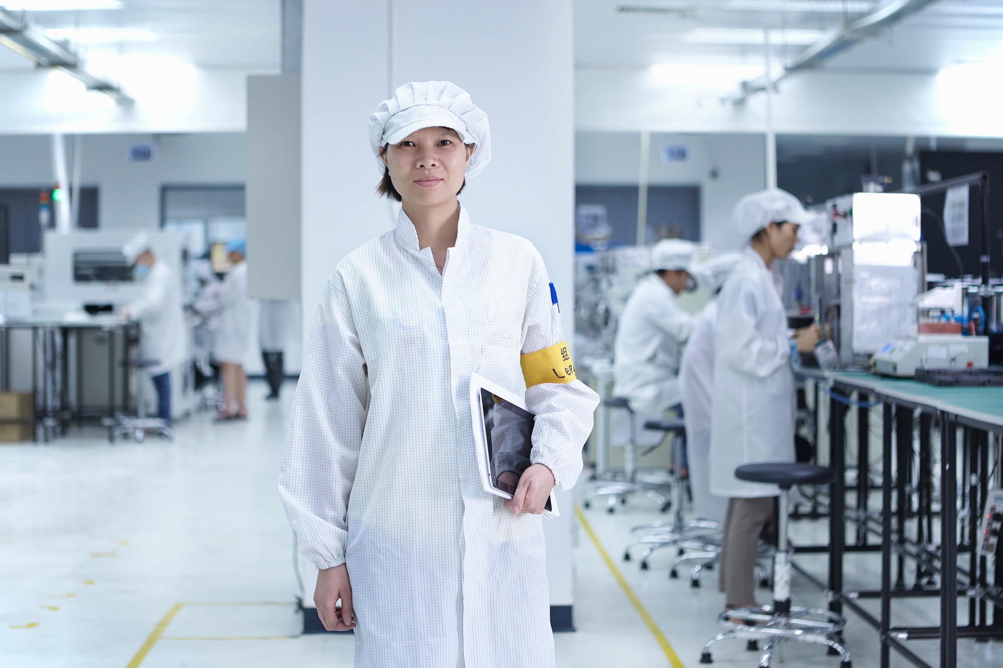 Portrait of worker in factory that specialises in creating functional circuits on flexible surfaces