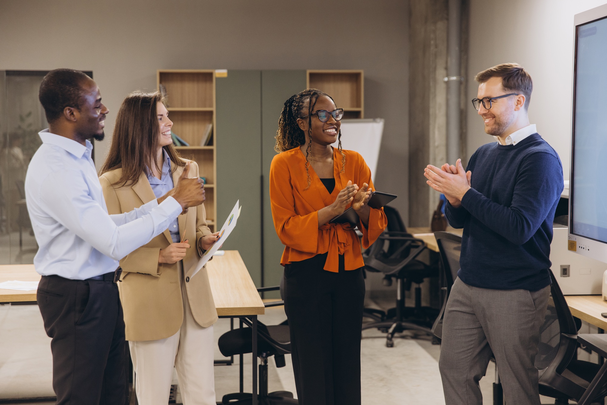 Professional team brainstorming, sharing insights and celebrating achievements