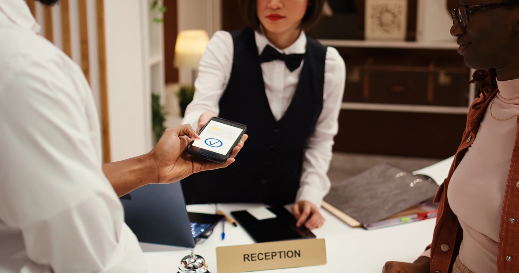 Receptionist using POS payment system