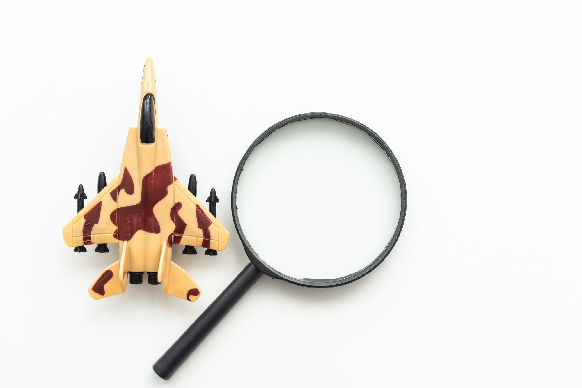 Review airlines company service and tickets price concept. Airplane model under magnifying glass on