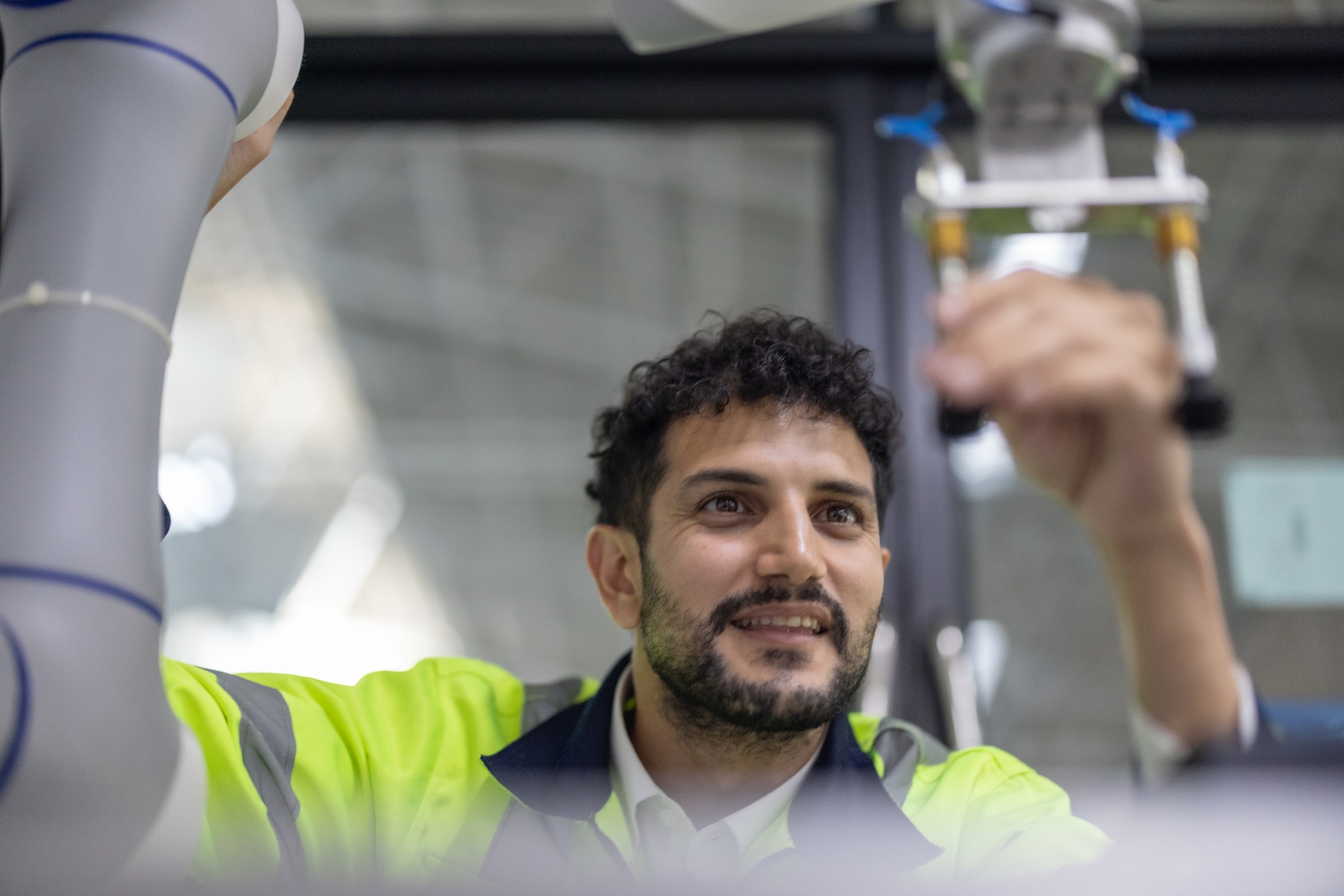 Robotic engineer trains in operations, programming, and QC via workshops at manufacturing academy