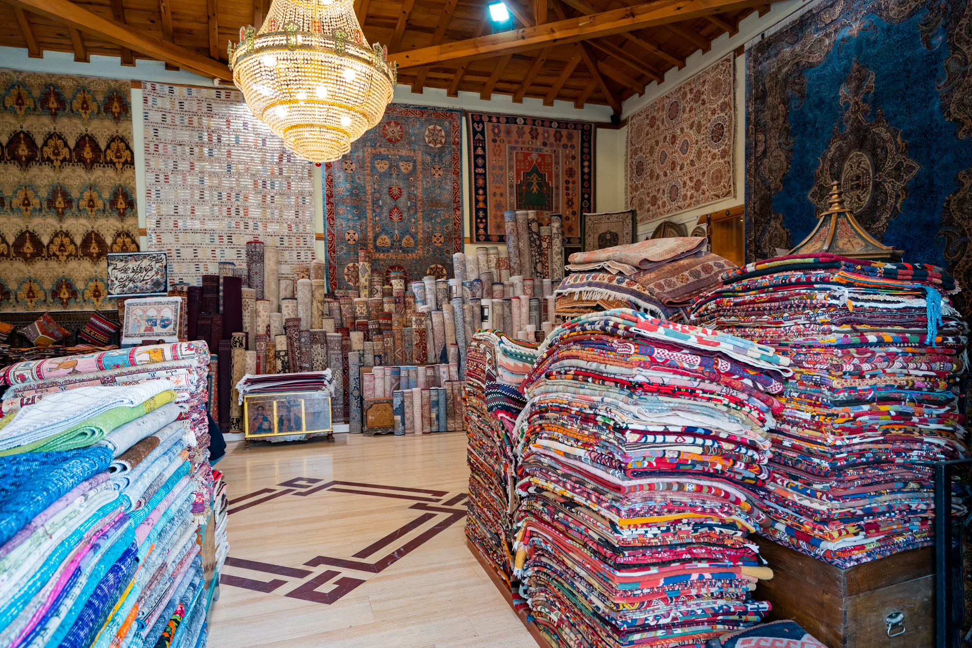 Rolled-Up Carpets In A Variety Of Colors In A Carpet Store
