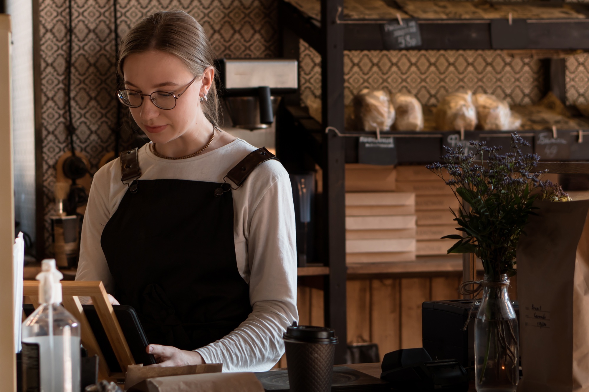 Sales woman in bakery and coffee shop