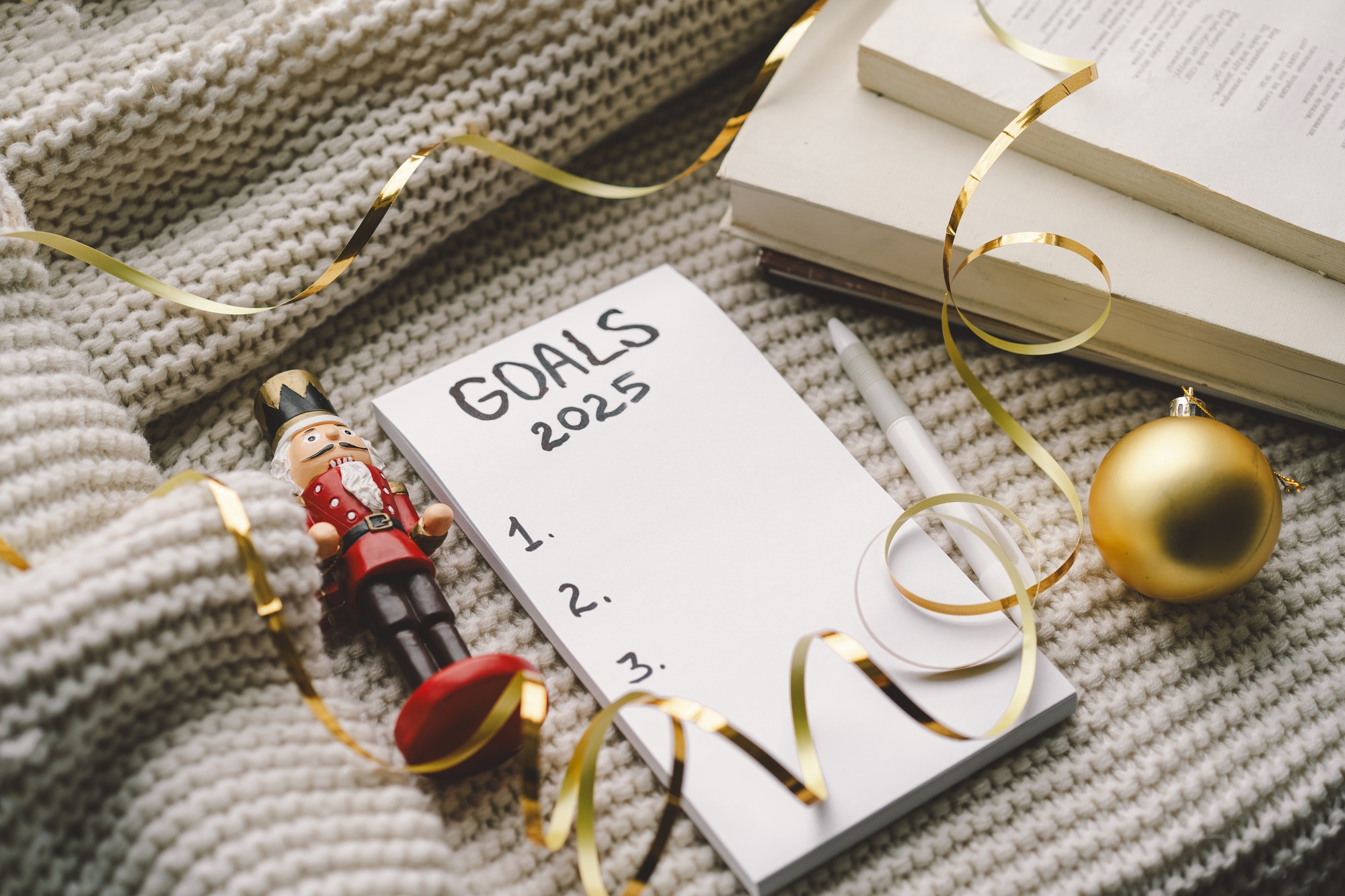 Setting New Year's goals with cozy vibes and festive decorations in preparation for 2025