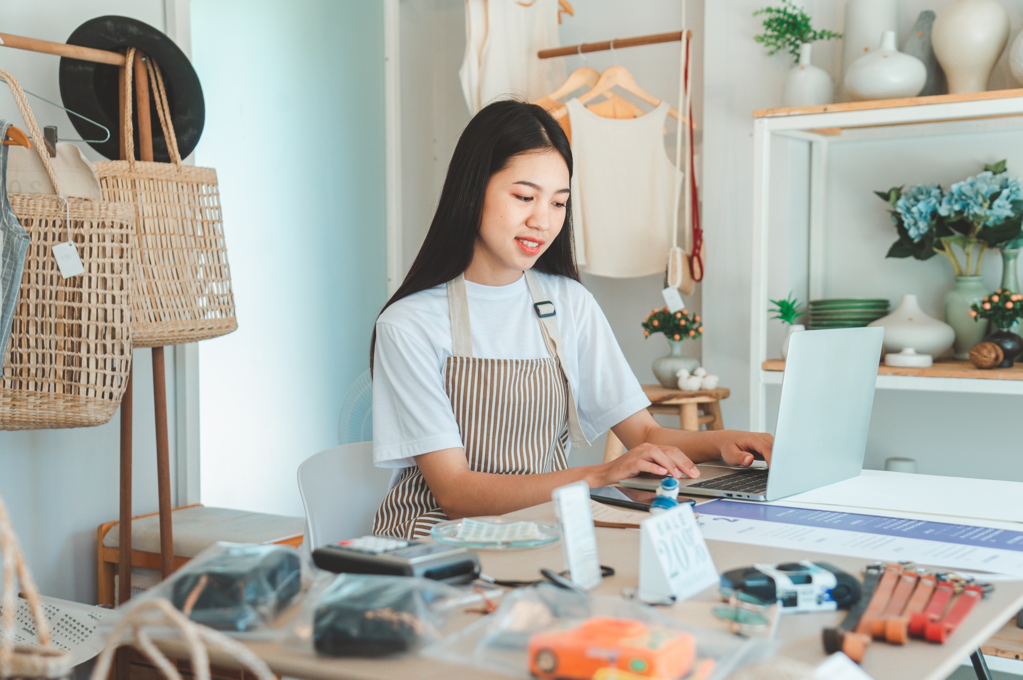 Small business owners inspecting merchandise And talk to customers