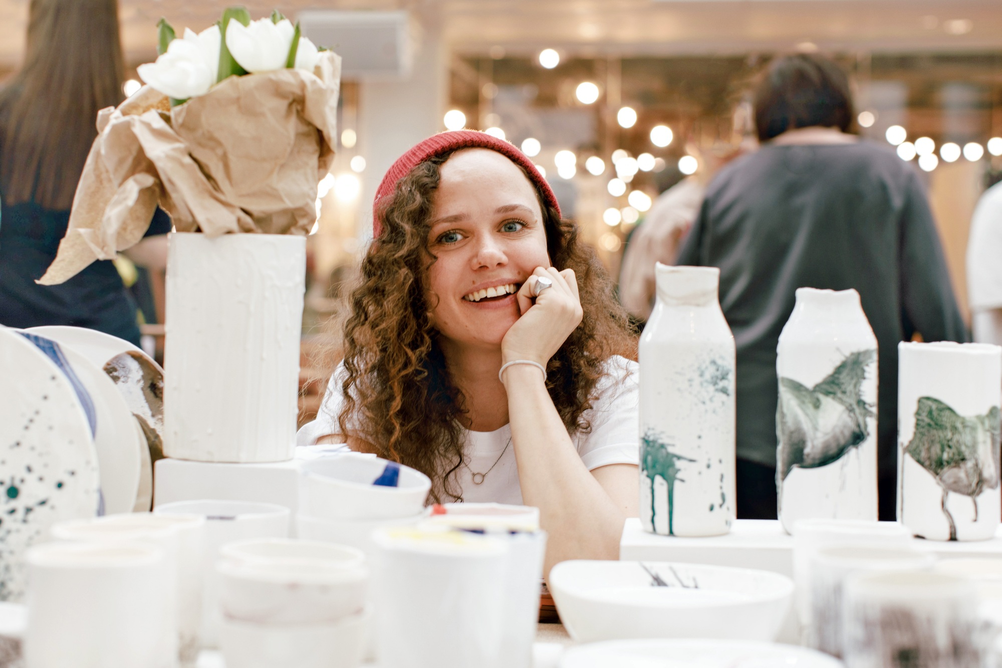Small business woman sells her crockery made in a craft workshop