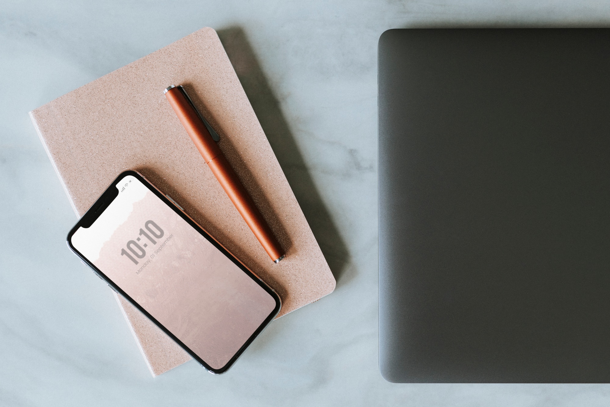 Smartphone mockup on a notebook