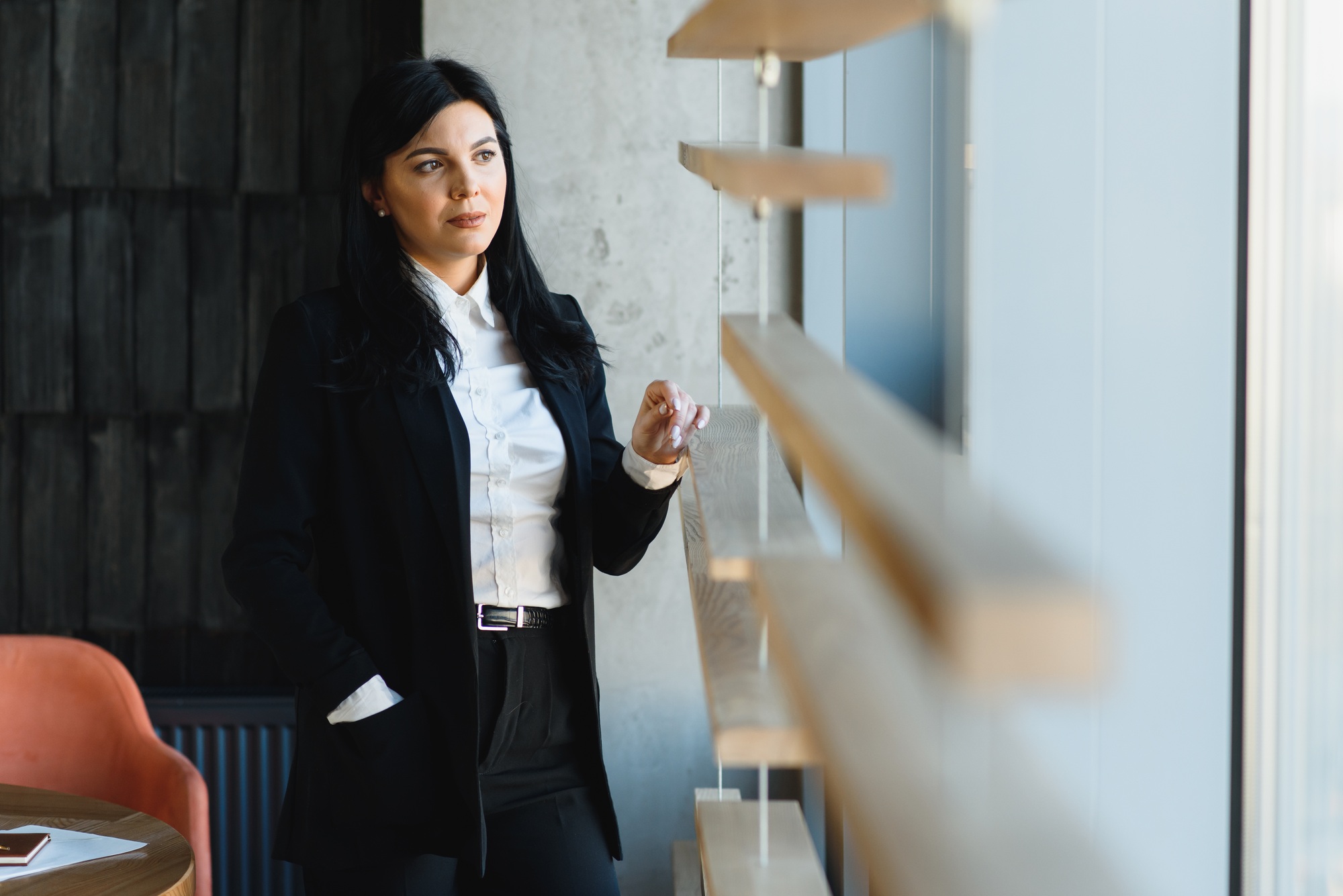 Smiling likable sincere and charming business woman financial executive type portrait inside