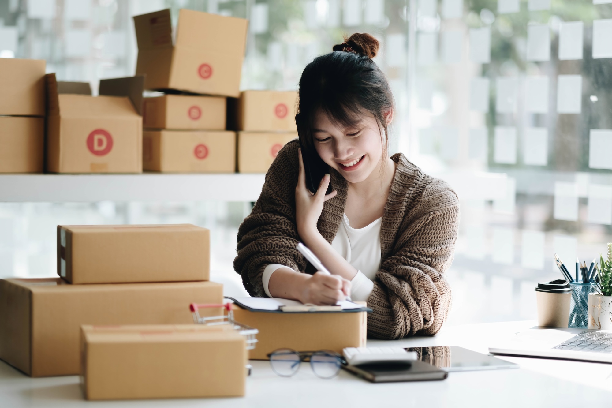 Startup small business entrepreneur SME freelance woman work with smart phone, Young Asian small