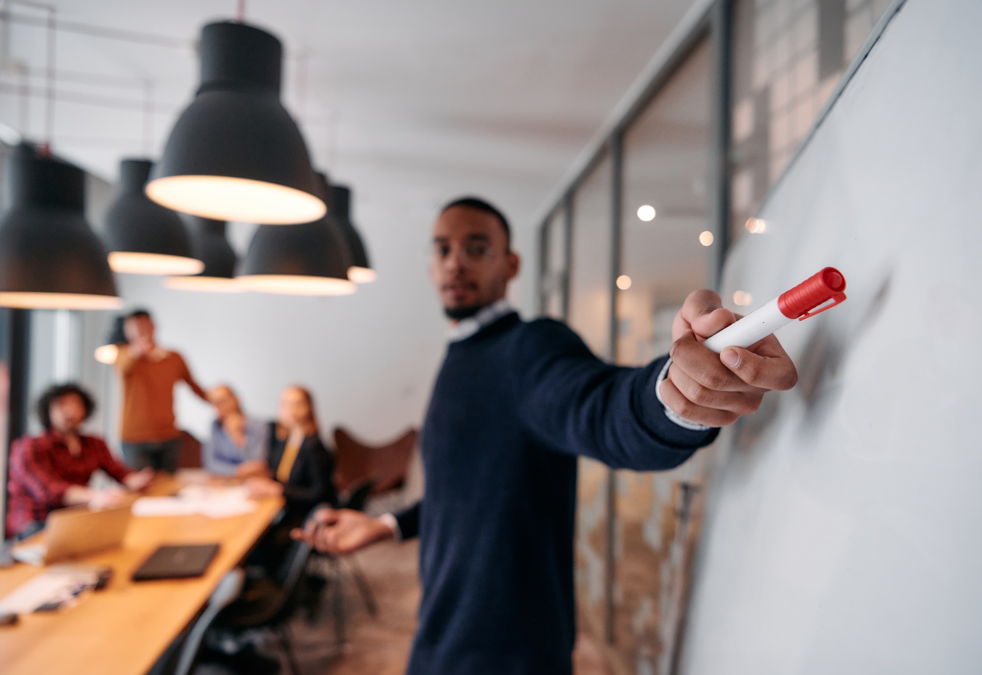 Strategic Leadership: African American Businessman Leading Crucial Corporate Meeting.