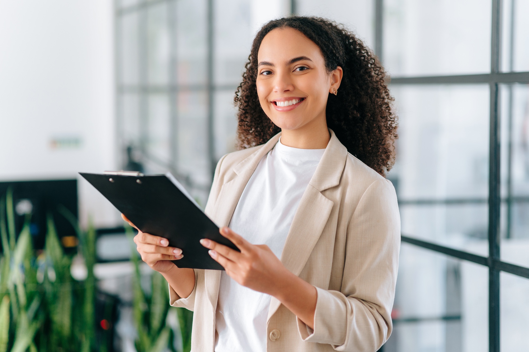 Successful elegant pretty multiracial woman, successful employee of a company, female teacher