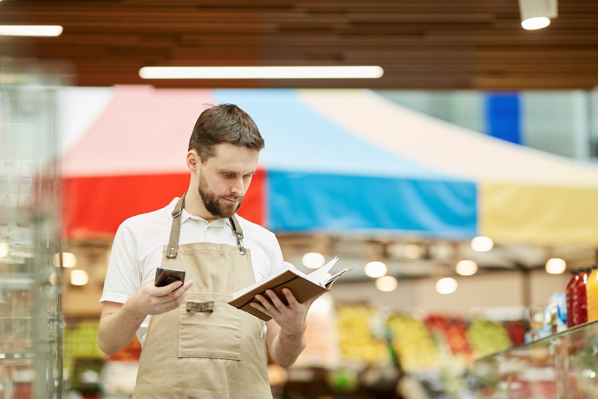 Supermarket Worker Calling Supplier