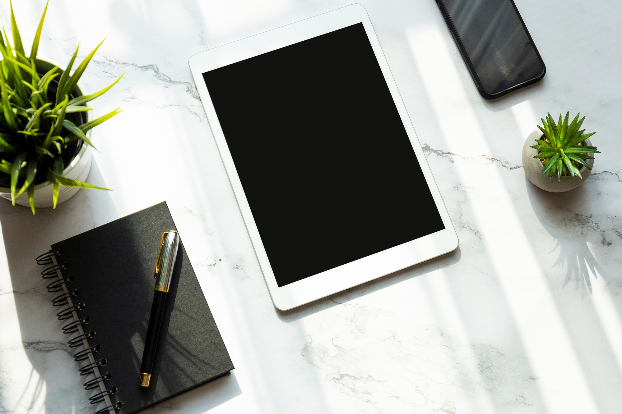 Tablet and smartphone on desk, mockup