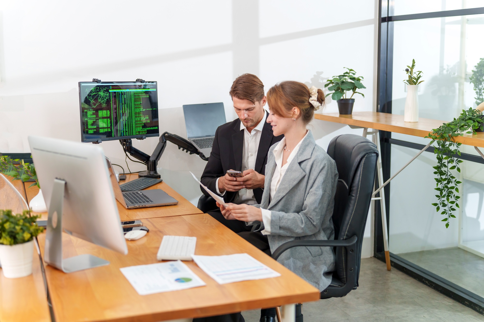 Team collaboration in a modern office setting focused on technology and data analysis