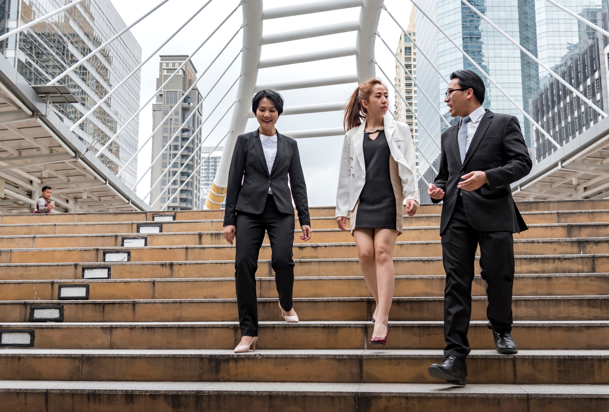 Team leadership business people walking together city life. Group of business team leader power
