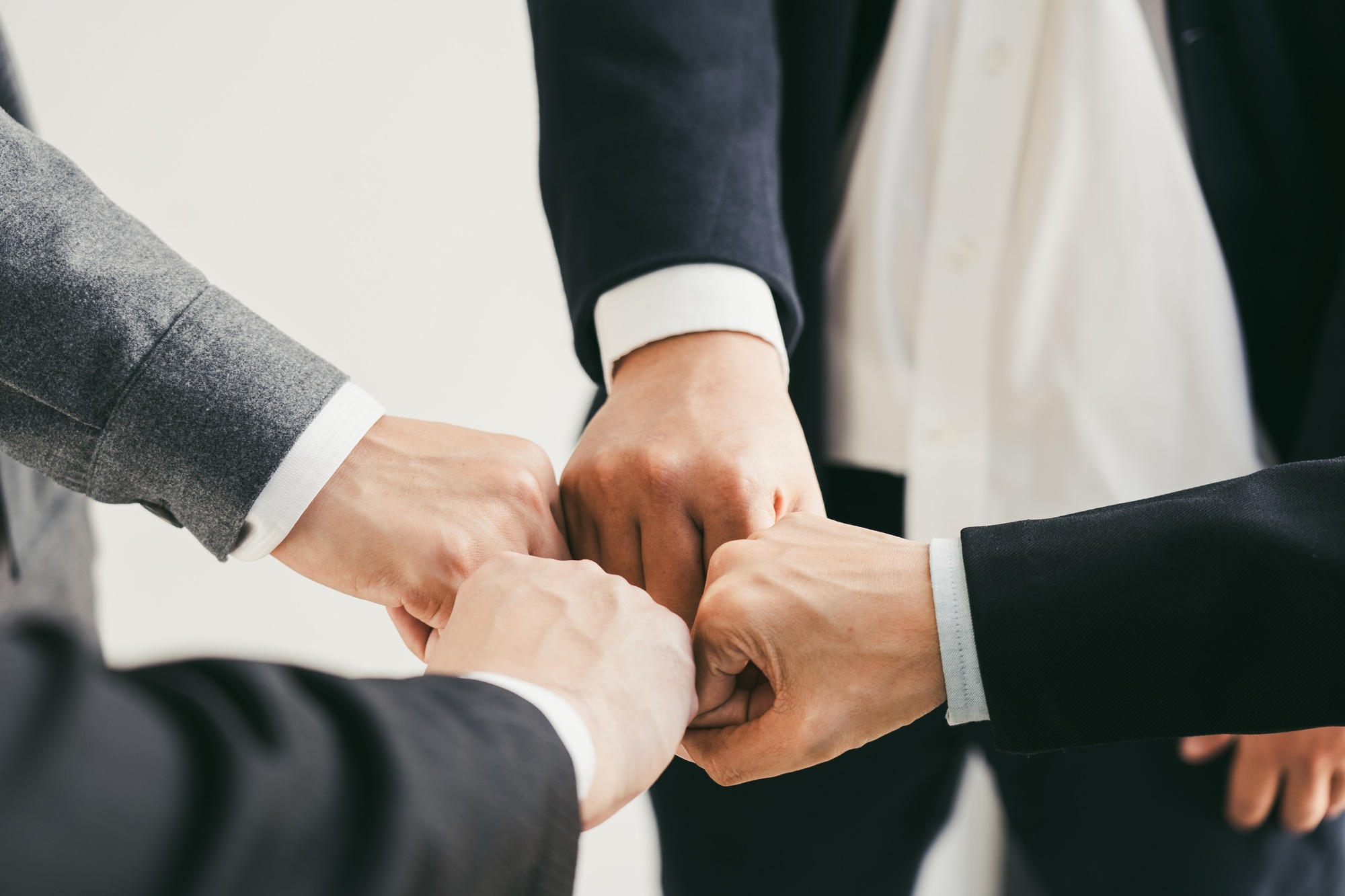 Teamwork, team building, responsibility and equal opportunities. Hand holding together