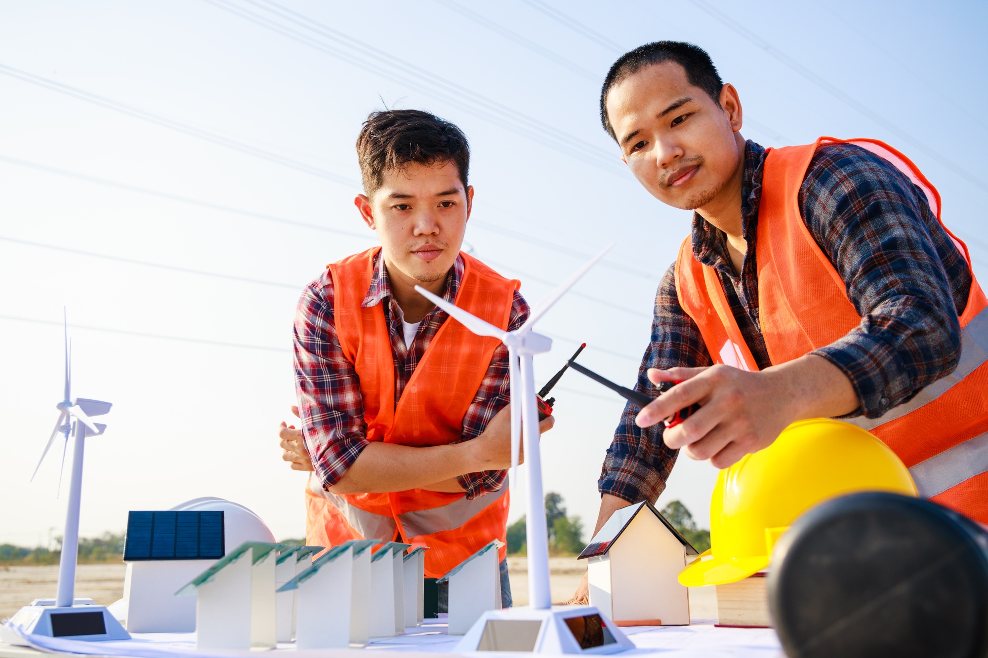 Two engineers discuss the project at the construction site. Teamwork, Leadership