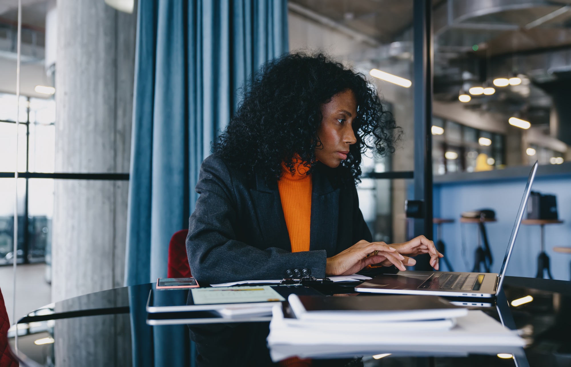 Concentrated Black UX/UI designer in her 30s