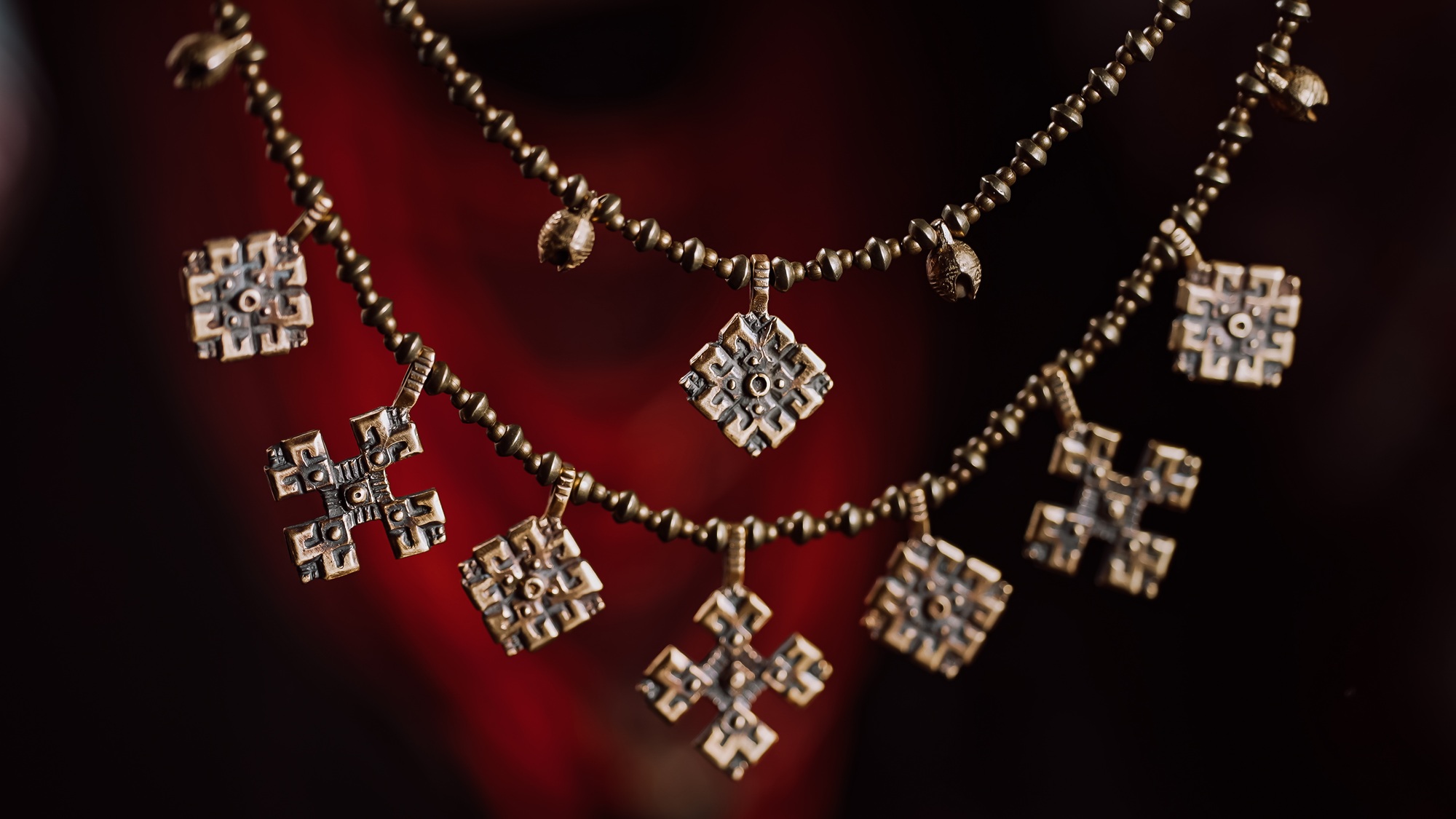 Ukrainian woman demonstrating authentic traditional jewelry necklace of Ukraine - Zgarda