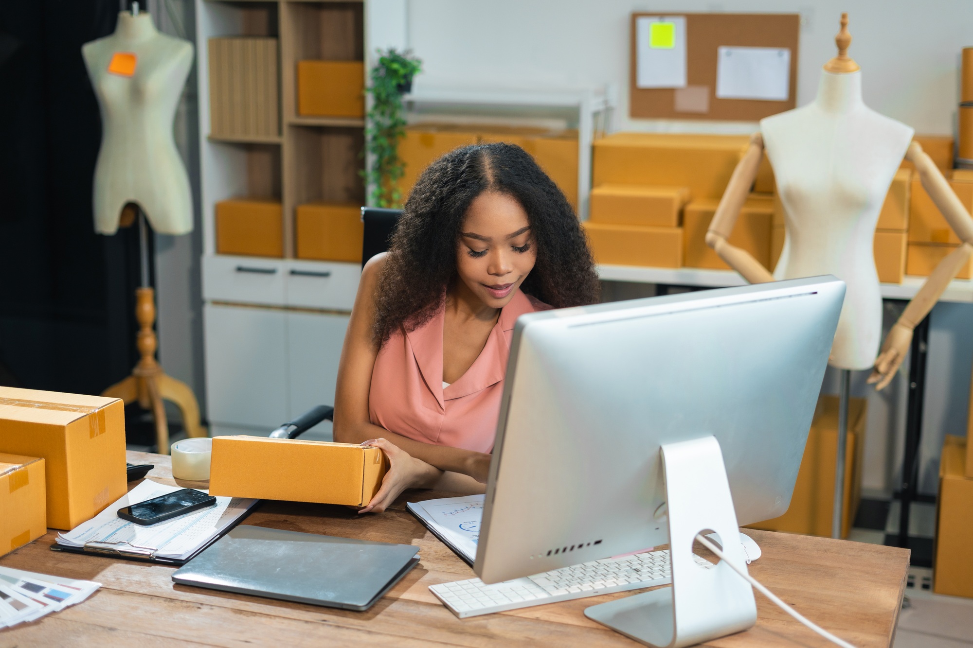 vlogger woman or designers, checking orders from customers