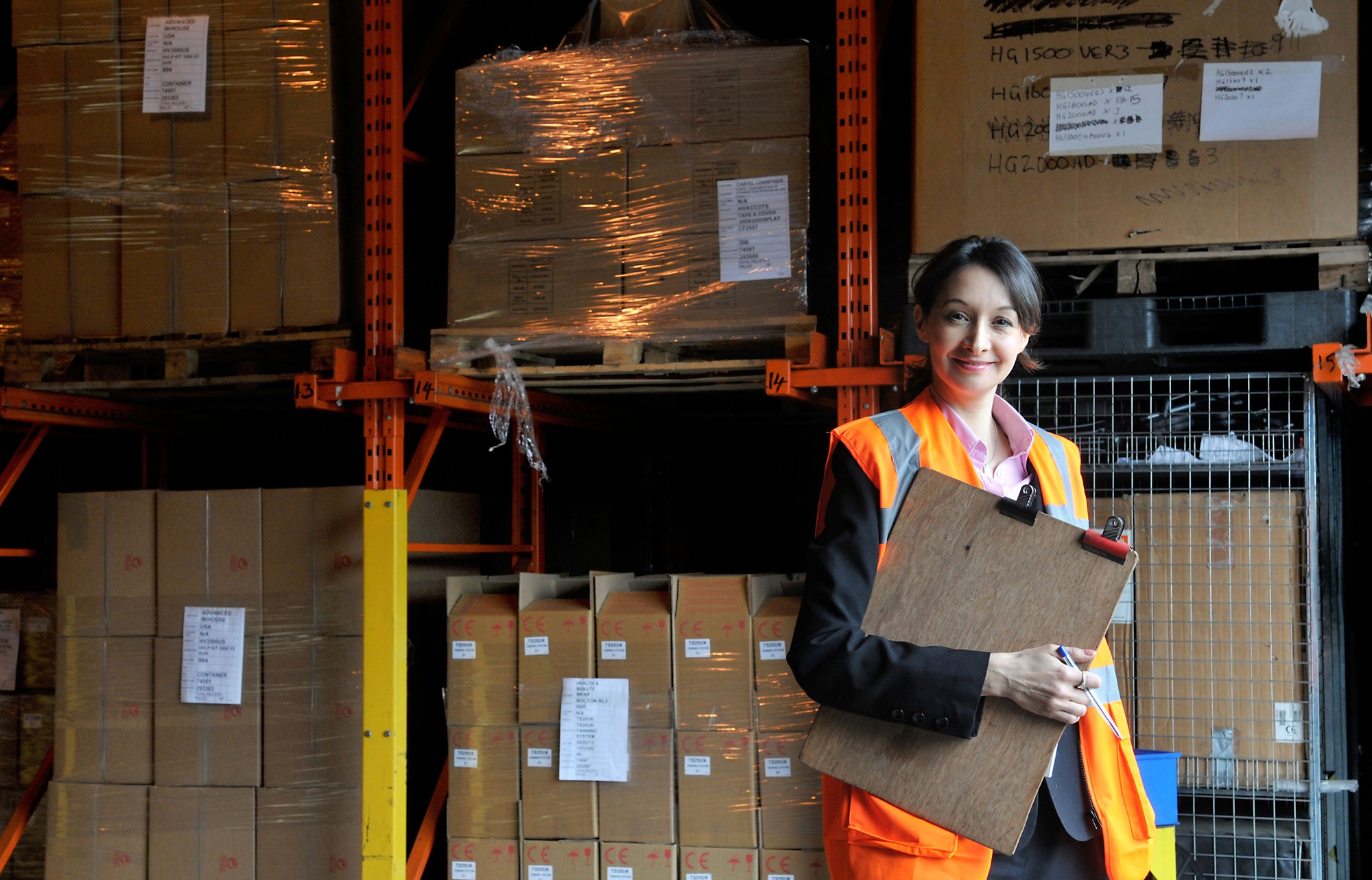 Warehouse worker confidently managing inventory
