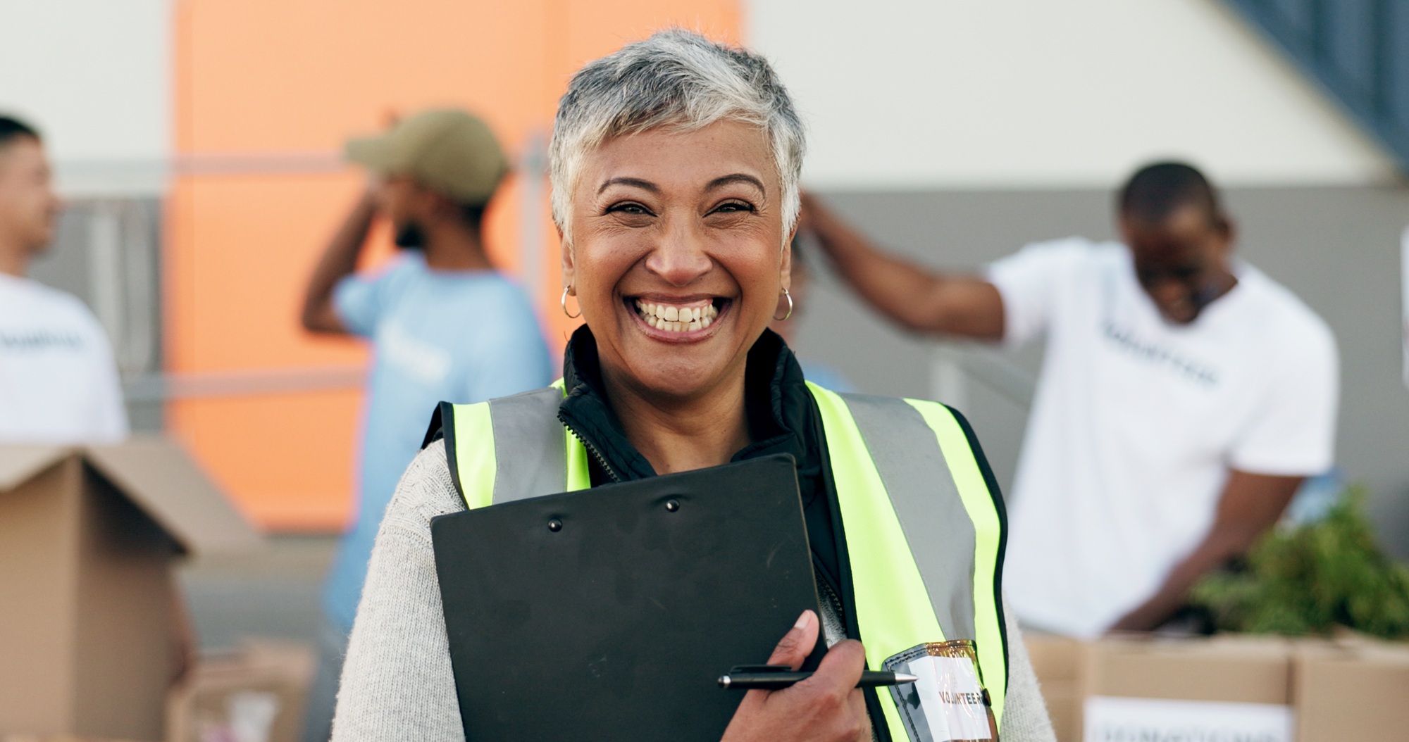 Woman, clipboard and donation for charity, volunteer and organizer for outreach program, smile and