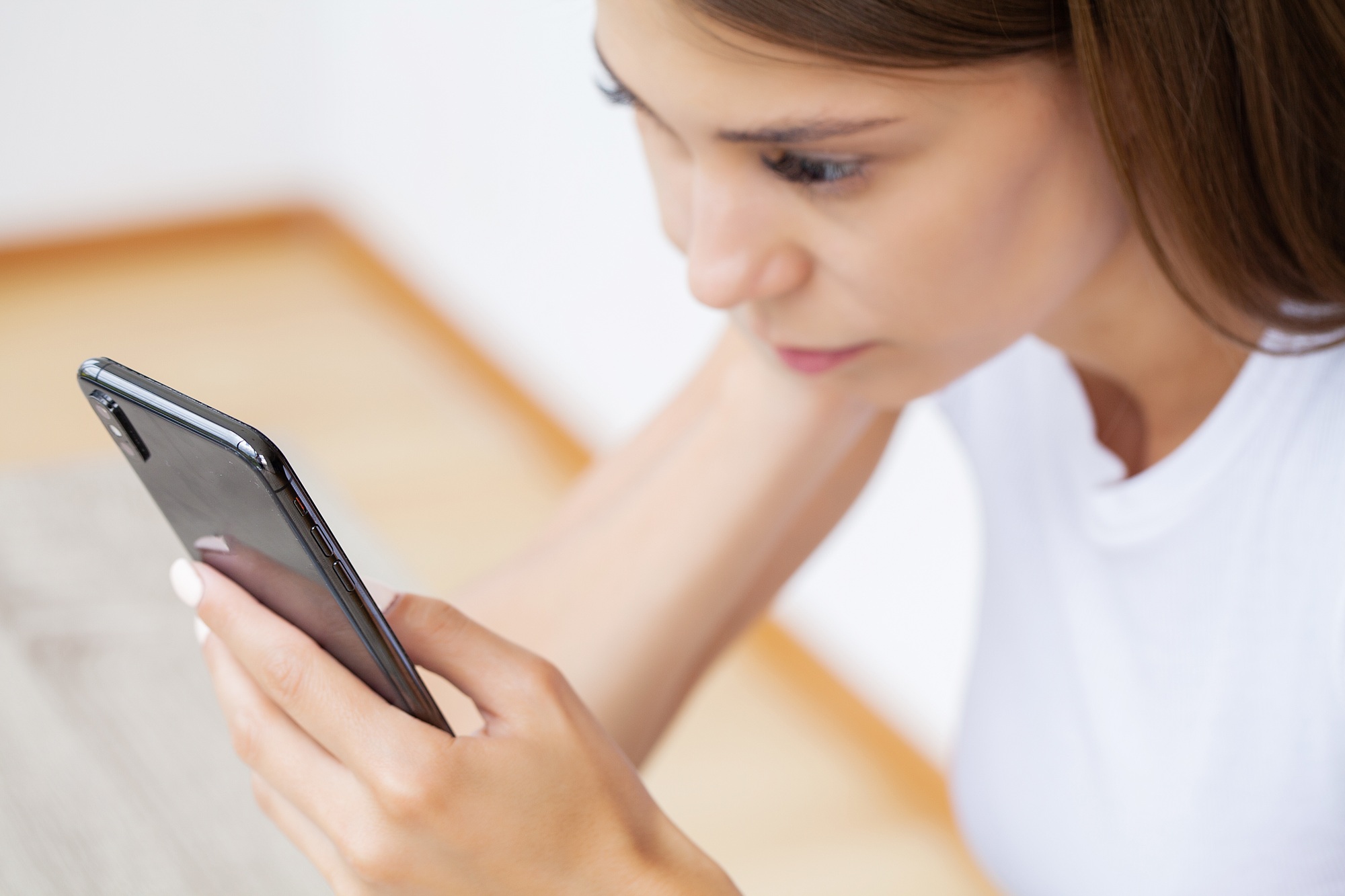 Woman holding smart phone chatting in social media