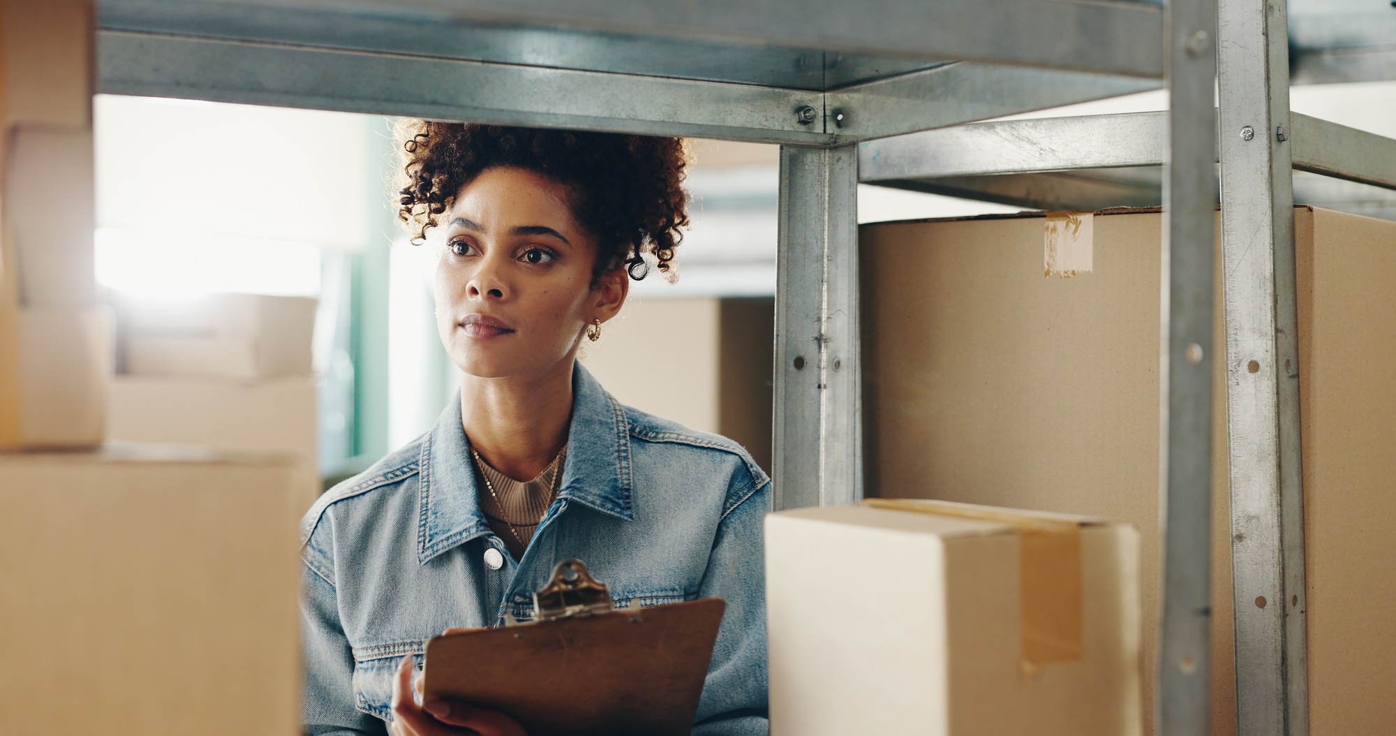 Woman, inspection and warehouse with boxes or inventory, quality control for freight distribution.