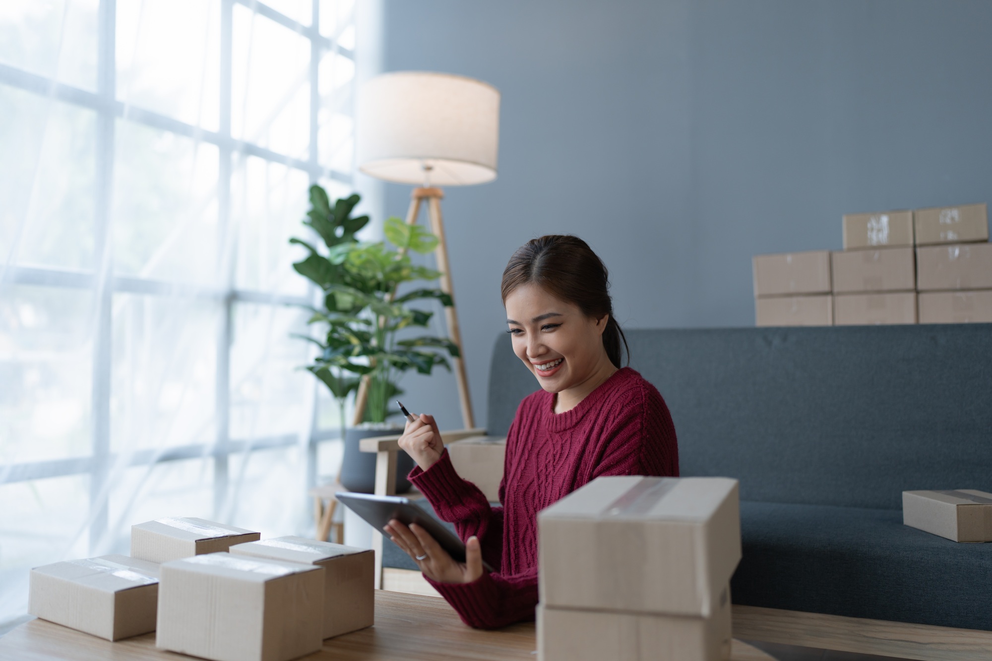 woman, online seller, Achieves sales success happiness using a tablet computer, goals