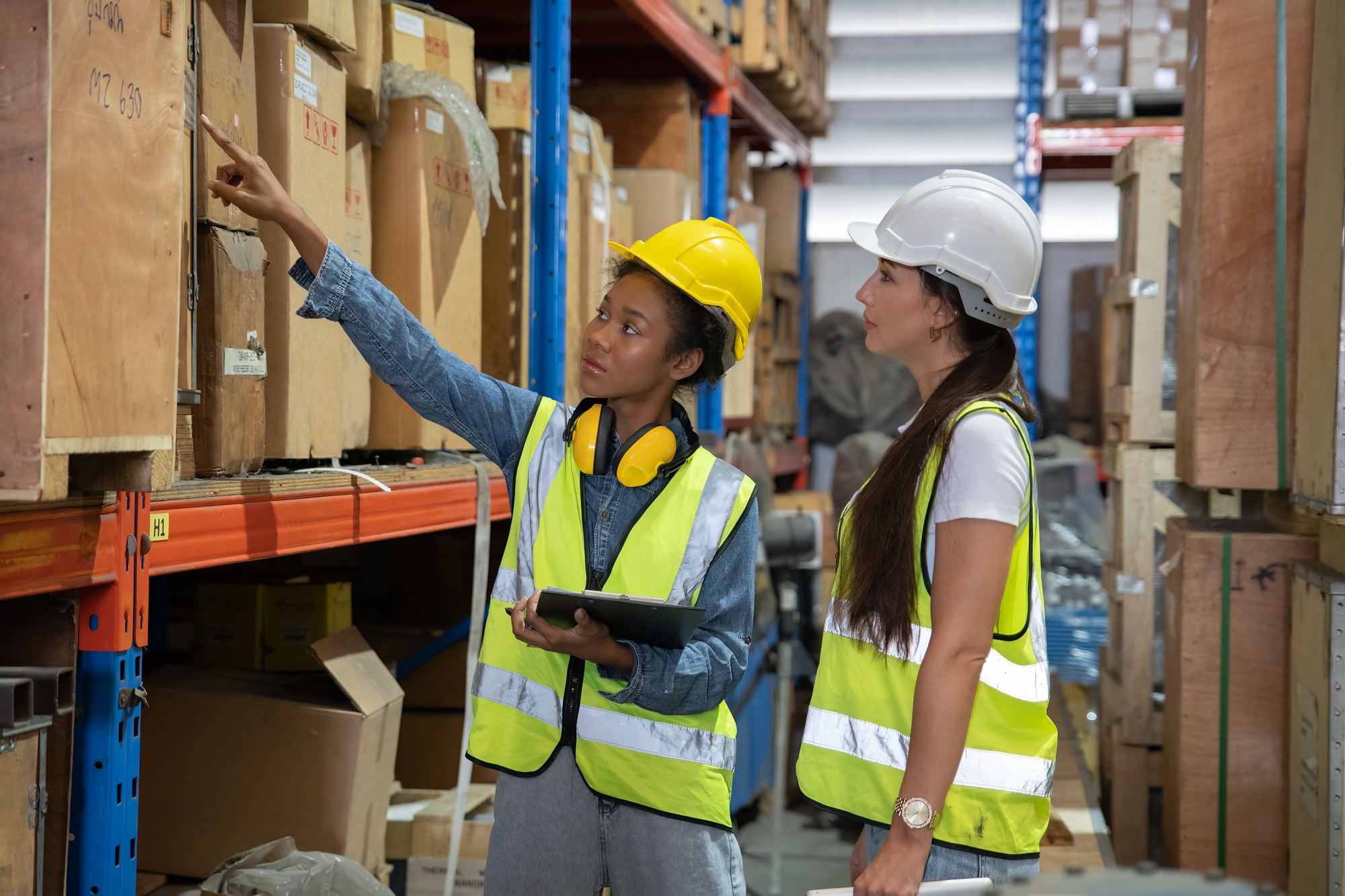 woman working in warehouse happy using tablet look scanning barcode for stock inventory check