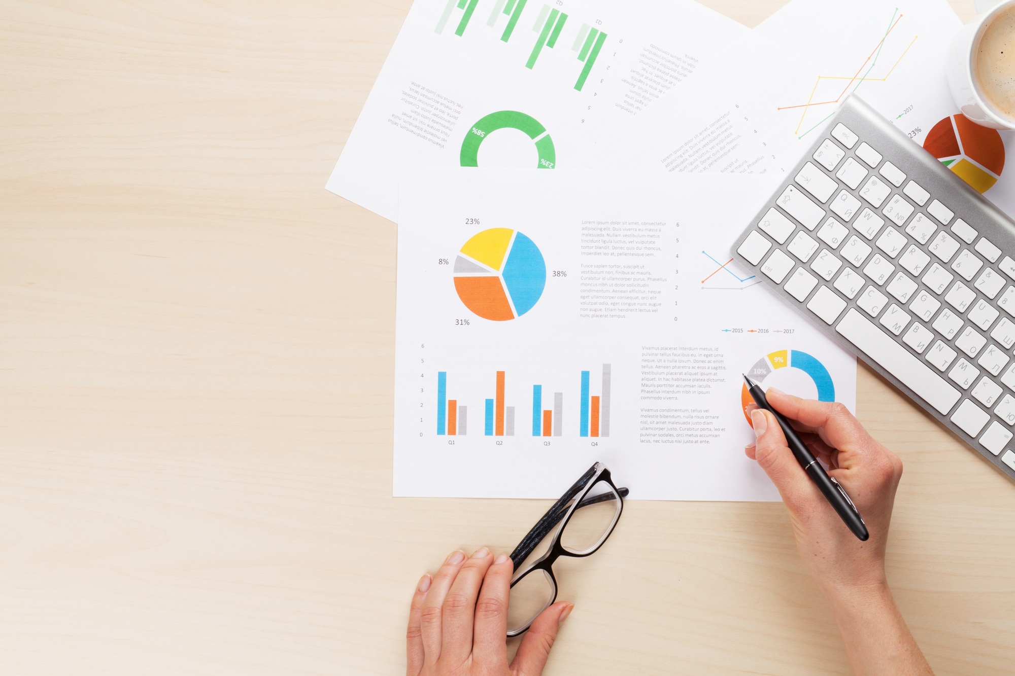Woman working with reports and charts