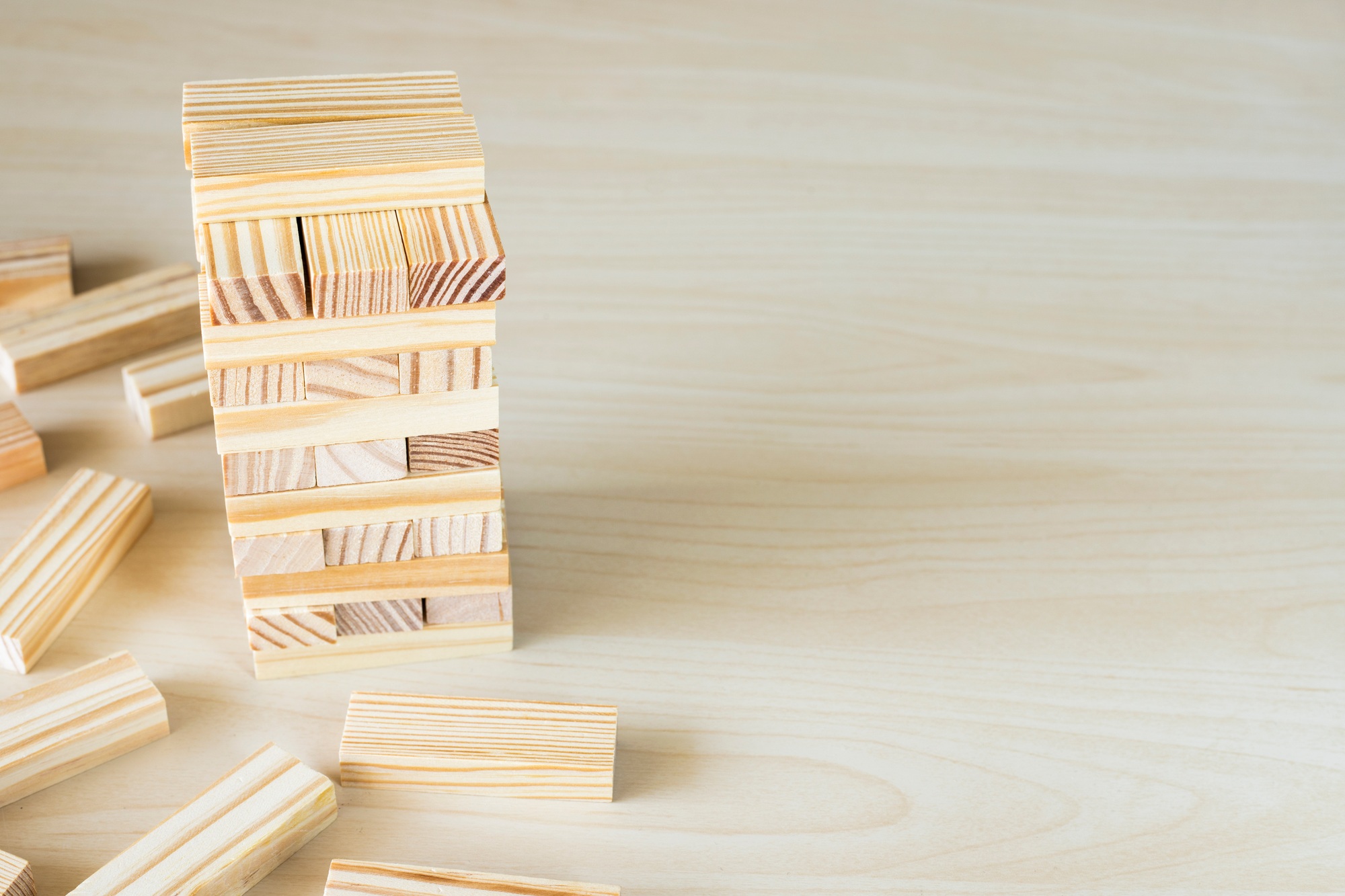 Wooden block tower on table. Growth and development concept.