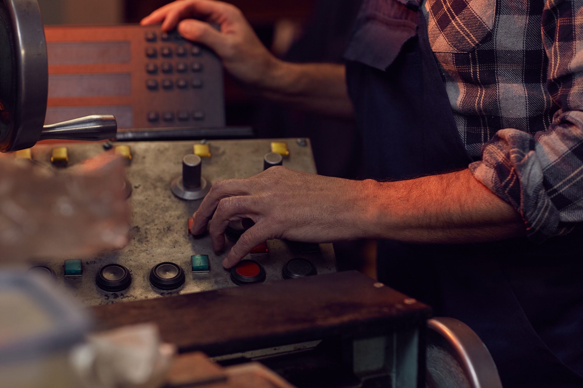 Worker turning on the machine