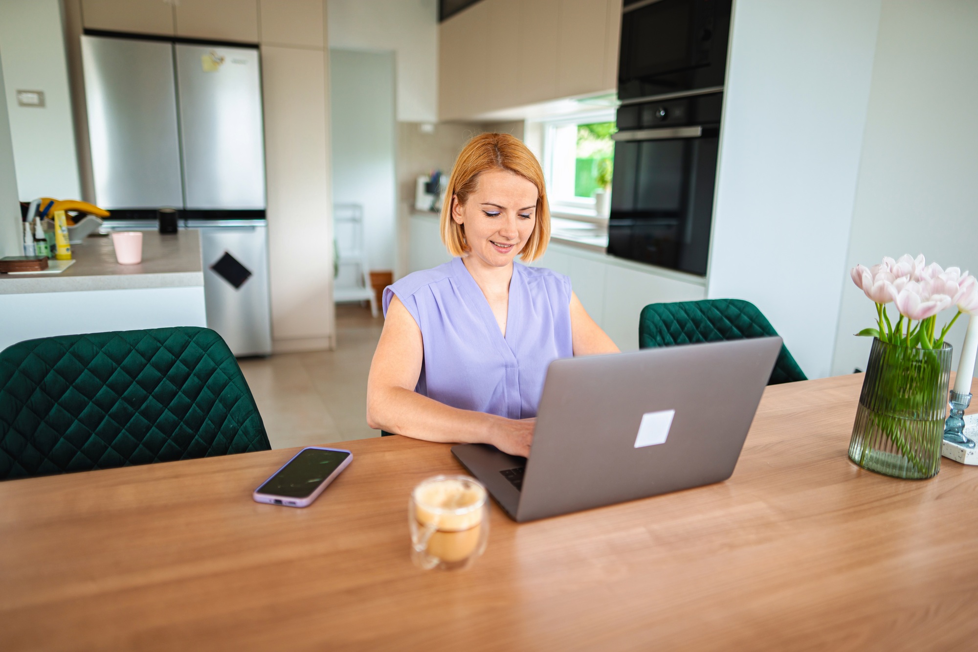 Working from home in a modern kitchen setting