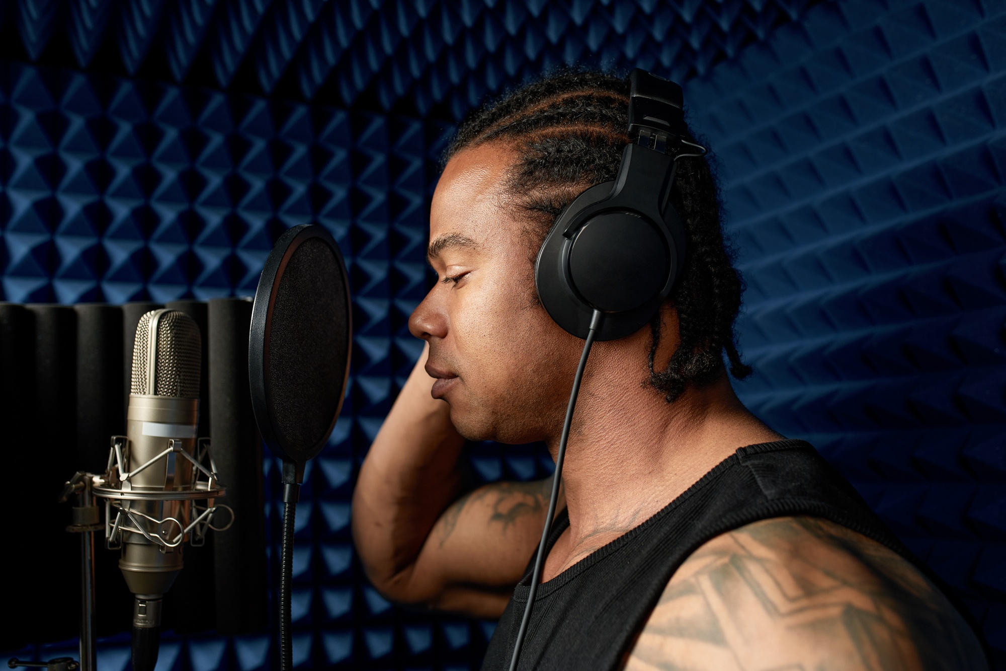 Young african american blogger recording new podcast, blogging, modern methods of personal brand