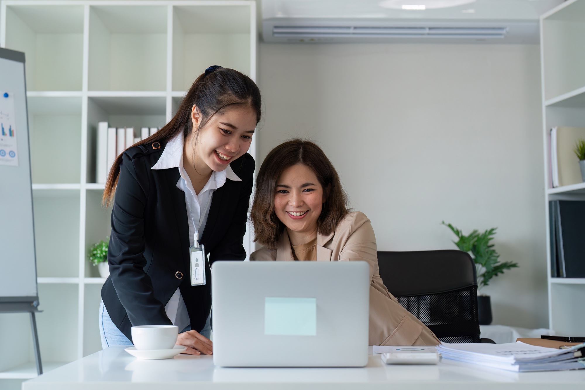 Young business woman discuss consult with senior leader executive colleague in office. teaching and