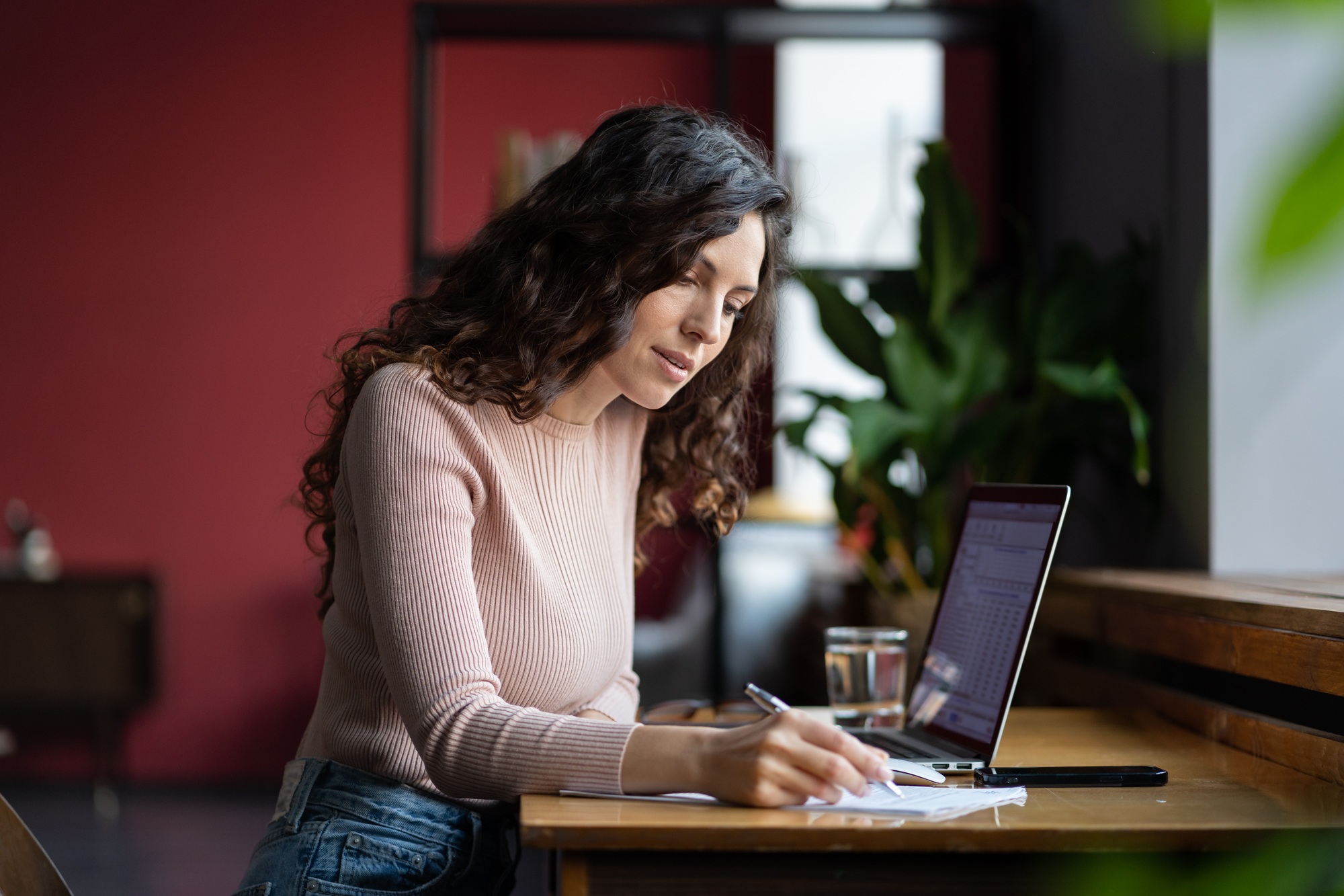 Young businesswoman prepare for financial report presentation and sales result make note in notebook