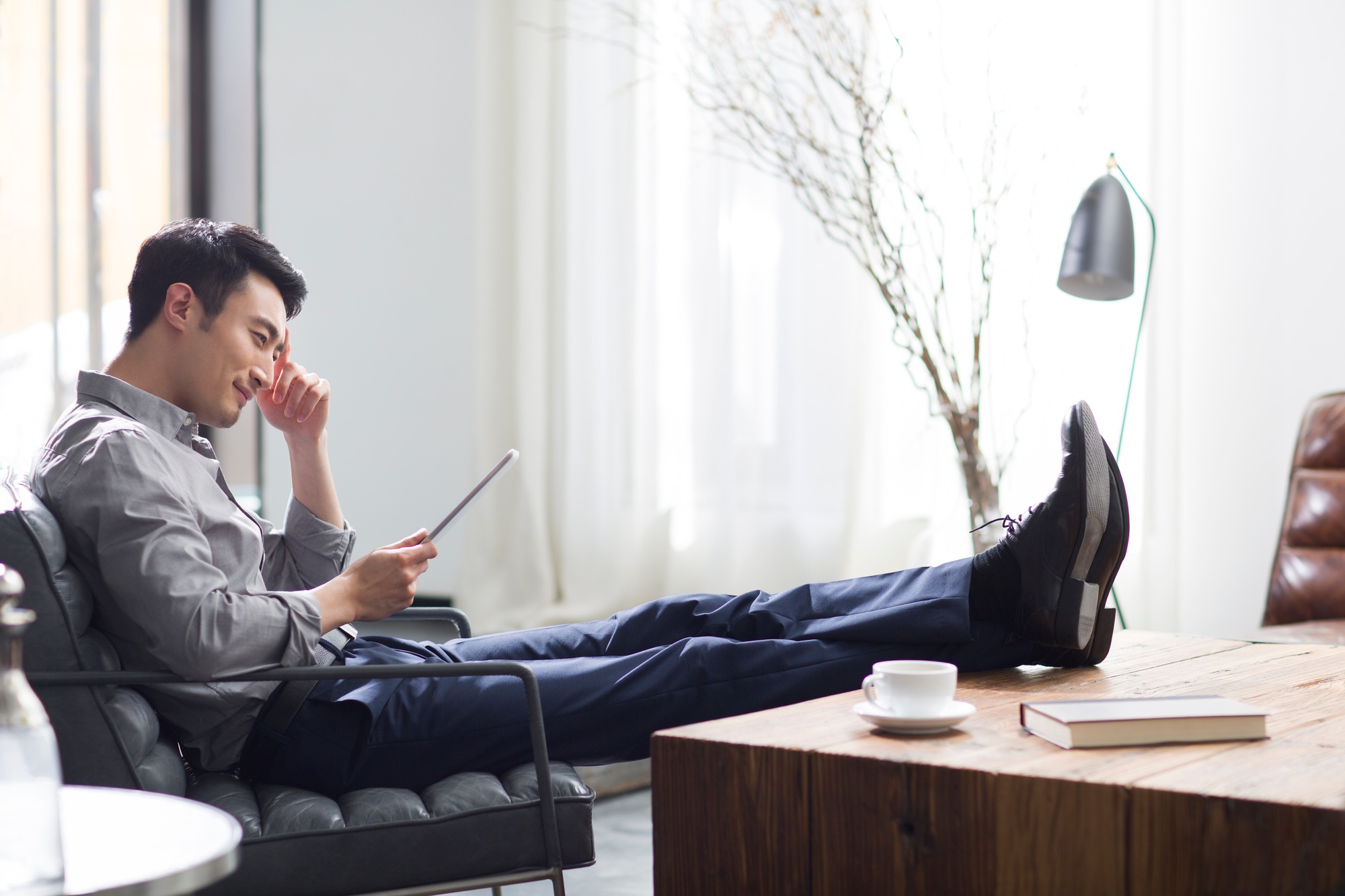 Young man using digital tablet in office
