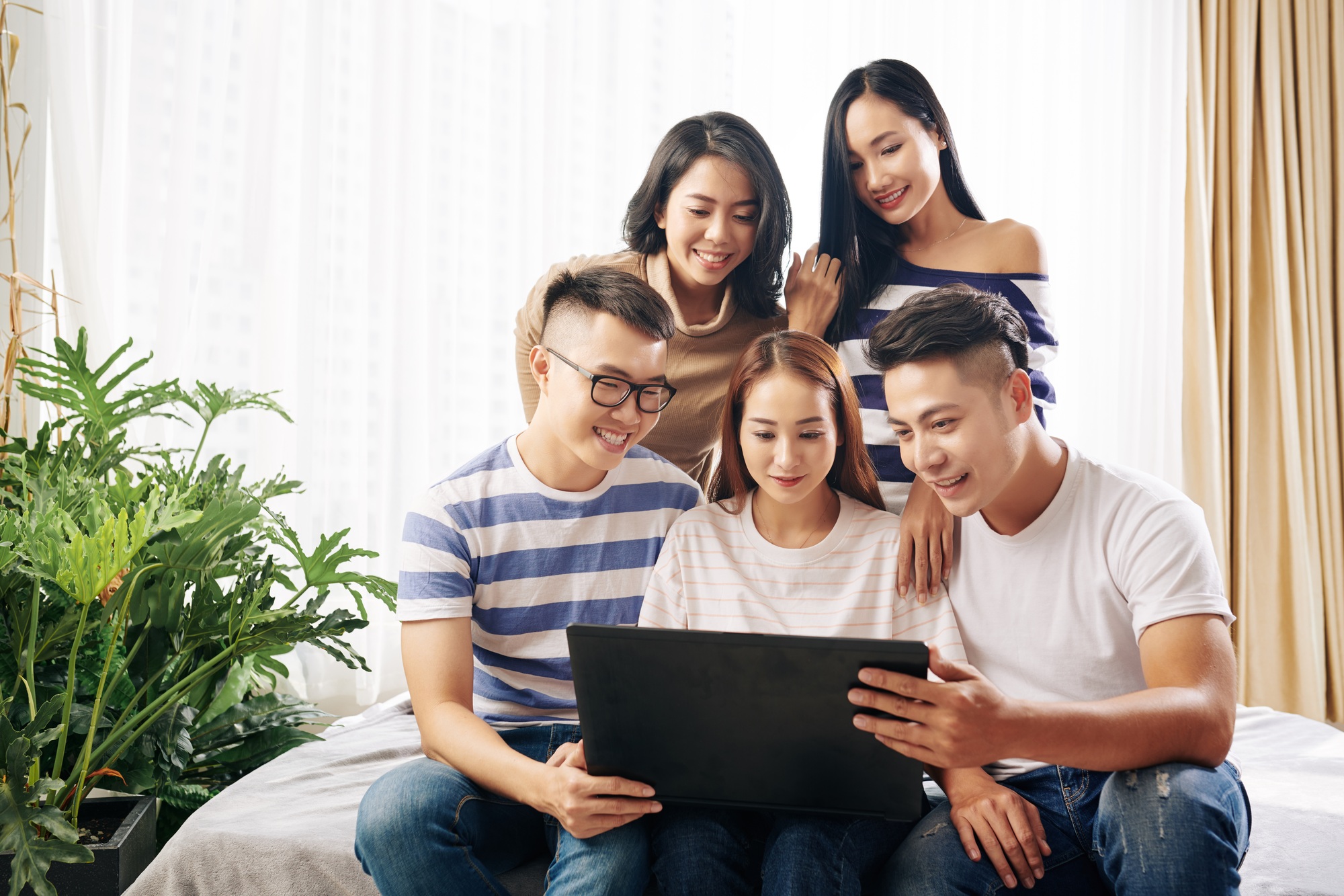 Young people watching movie trailer