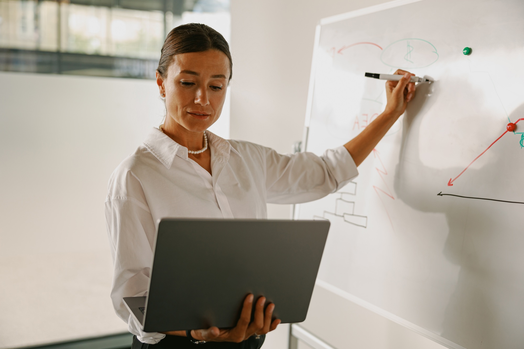 A Professional Woman Skillfully Presenting InDepth Data Analysis Within a Modern Office Environment