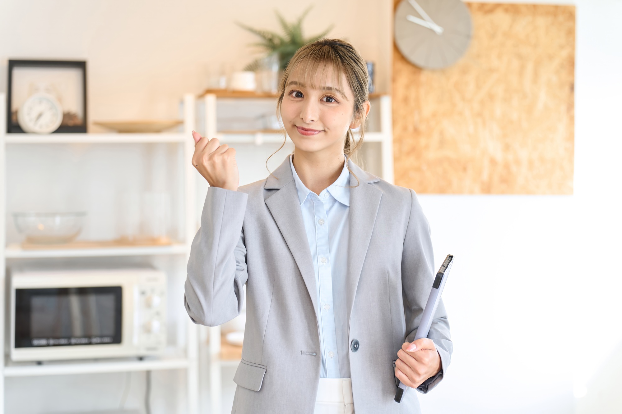 A real estate sales woman doing a fist pump