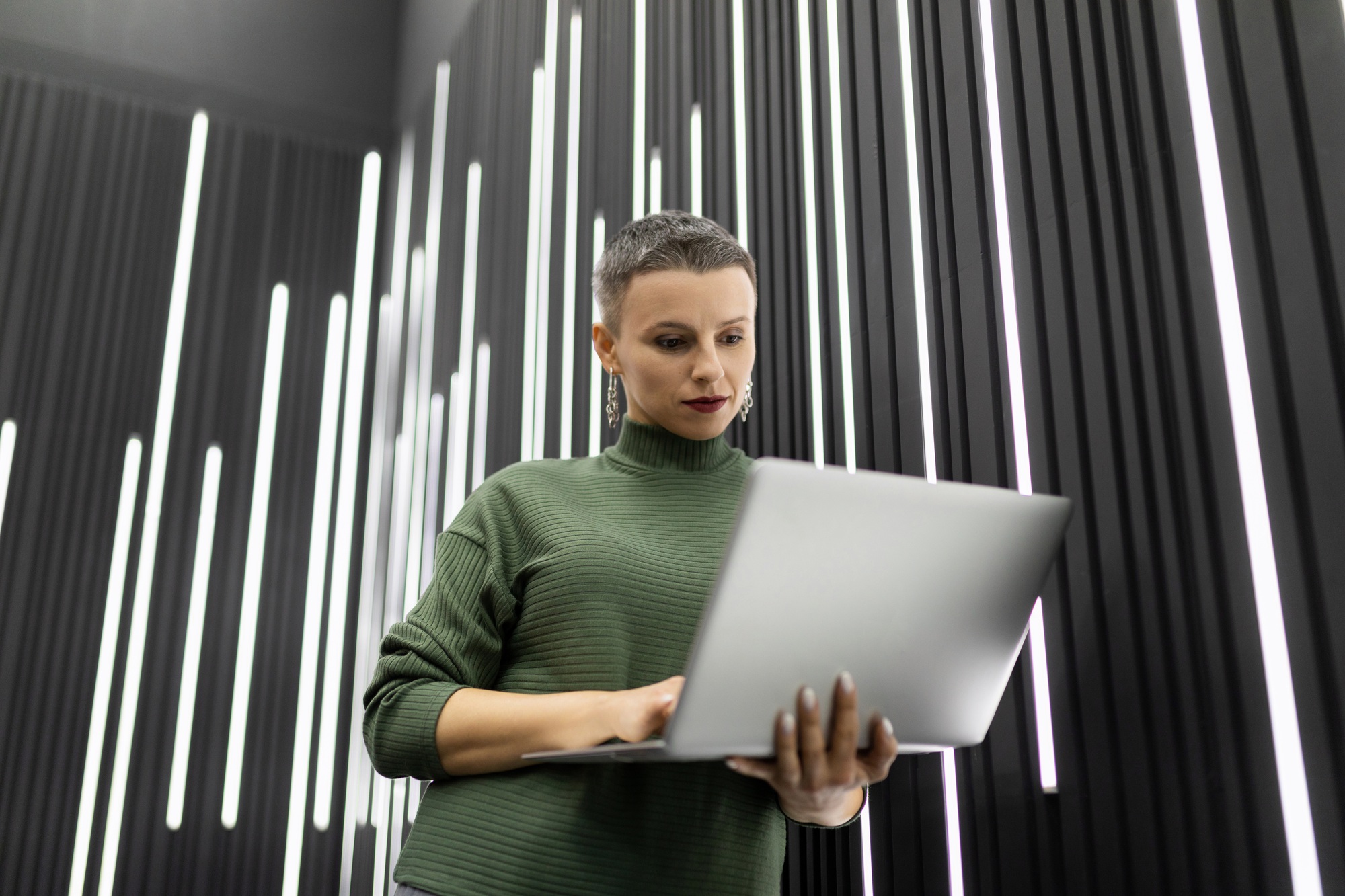 a woman programmer is developing a development strategy for her company in a stylish office