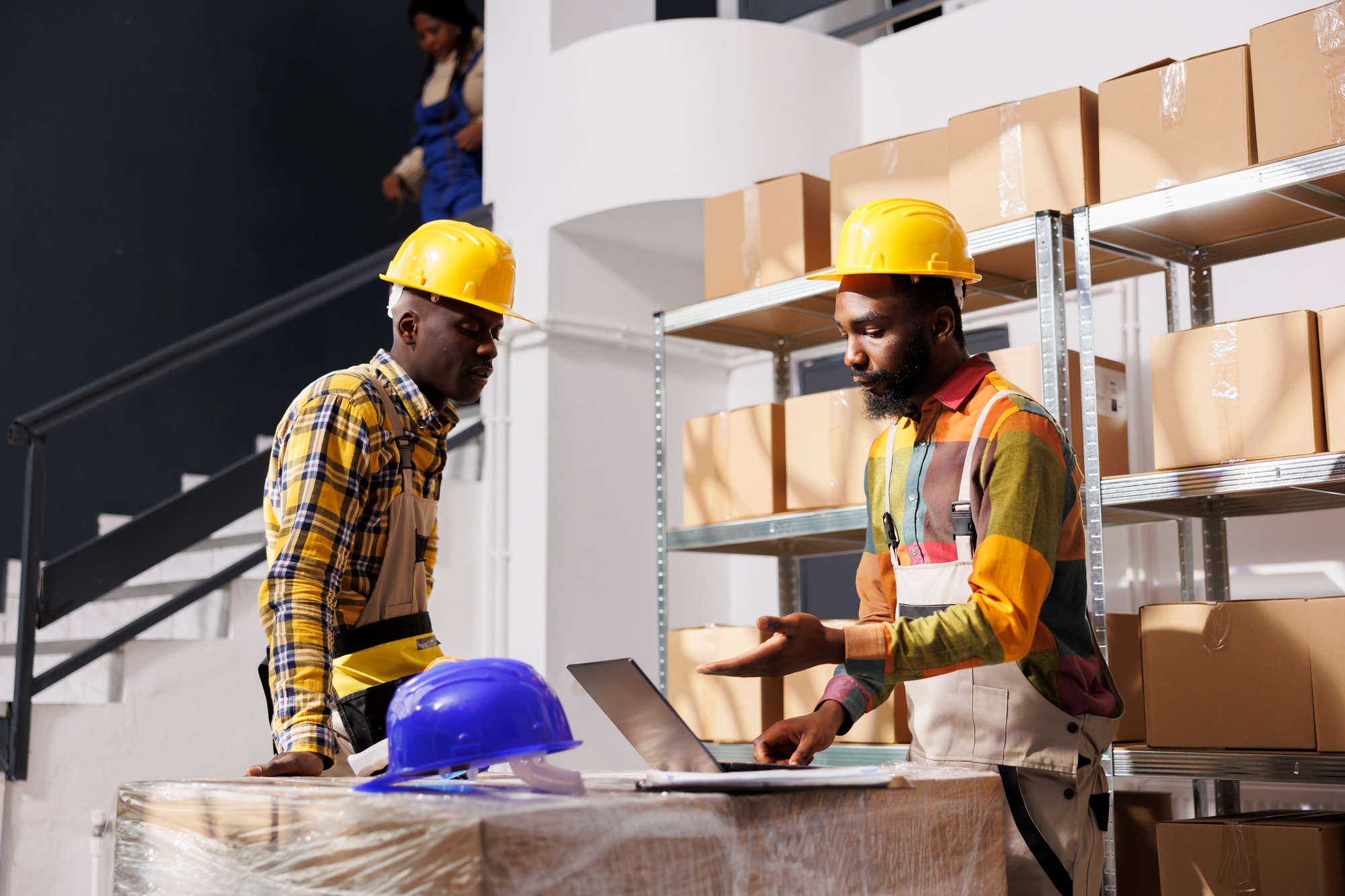 African american logistics managers discussing inventory management software