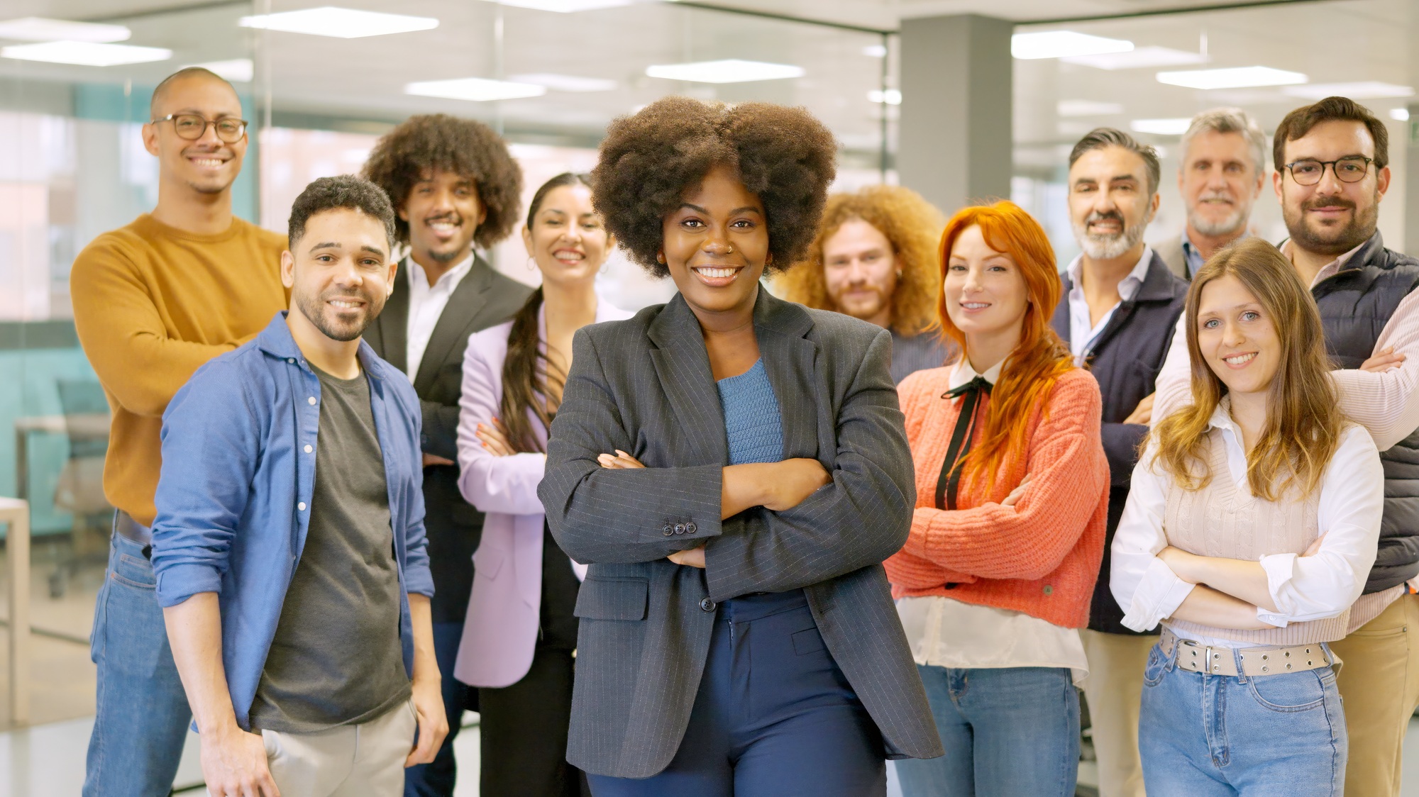 African female boss leading employees in a coworking