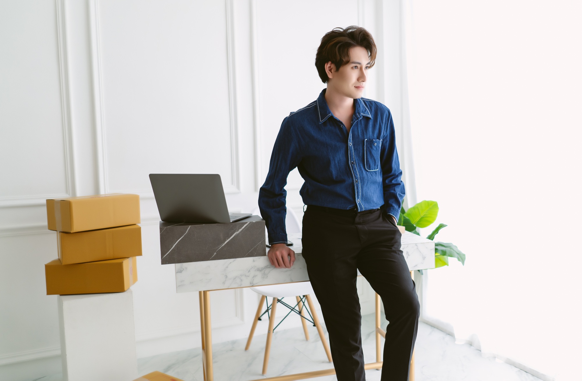 Asian entrepreneur owner working for omnichannel marketing commerce online in home office.
